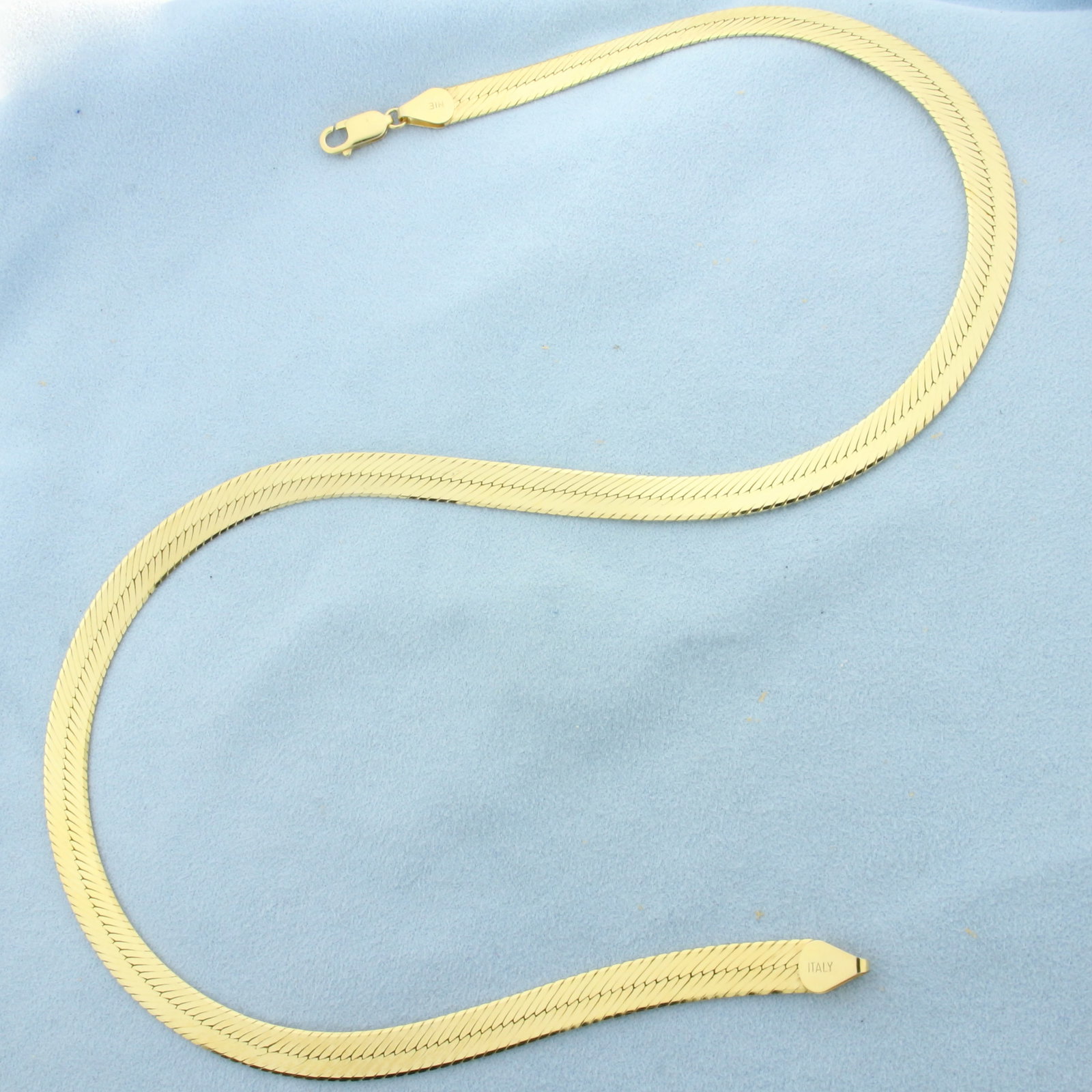 20 Inch Italian Wide Herringbone Chain Necklace in 14k Yellow Gold: In 14k Yellow Gold. 20 inches long. 7.4mm wide. Italian made. Lobster clasp.
