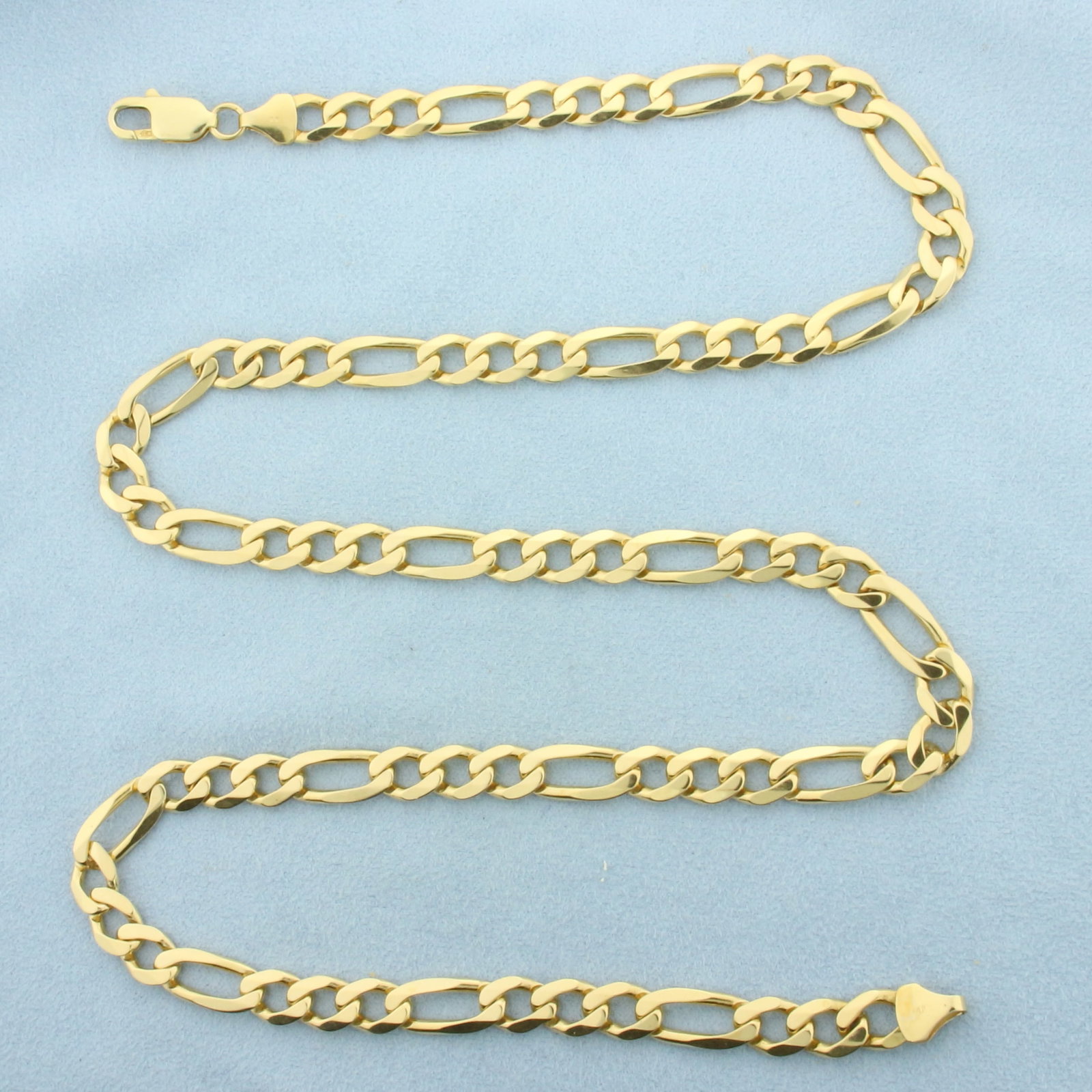 Mens 26 Inch Italian Figaro Link Chain Necklace in 14k Yellow Gold: In 14k Yellow Gold. 26 inches long. 7.3mm wide. Lobster clasp. 51.7g.