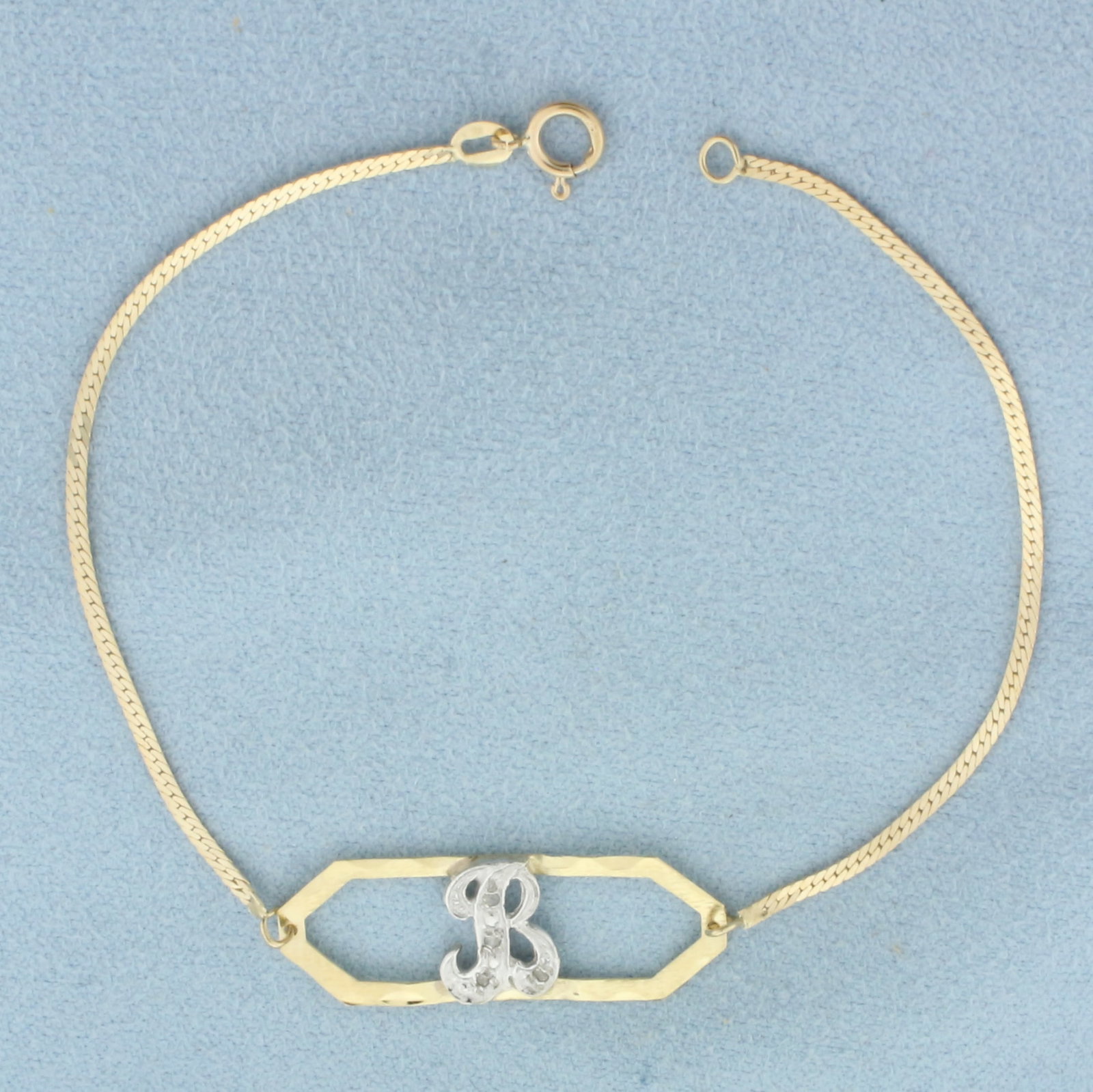 Diamond "B" Initial Monogram Bracelet in 14k Yellow Gold: In 14k Yellow Gold. Contains four high quality 1/2pt diamonds. 7 inches long. 3/8 inch wide at center. Spring clasp. 1.5g.