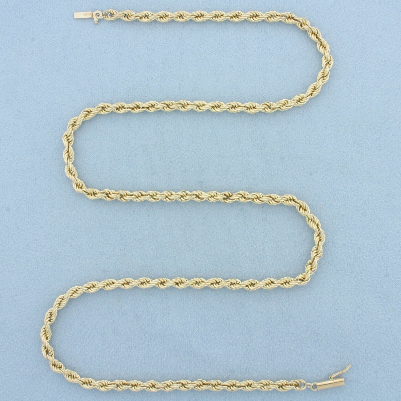 20 Inch Rope Link Chain Necklace in 14k Yellow Gold: In 14k Yellow Gold. 20 inches long. 3.8mm wide. Barrel clasp with safety latch. 8.1g.