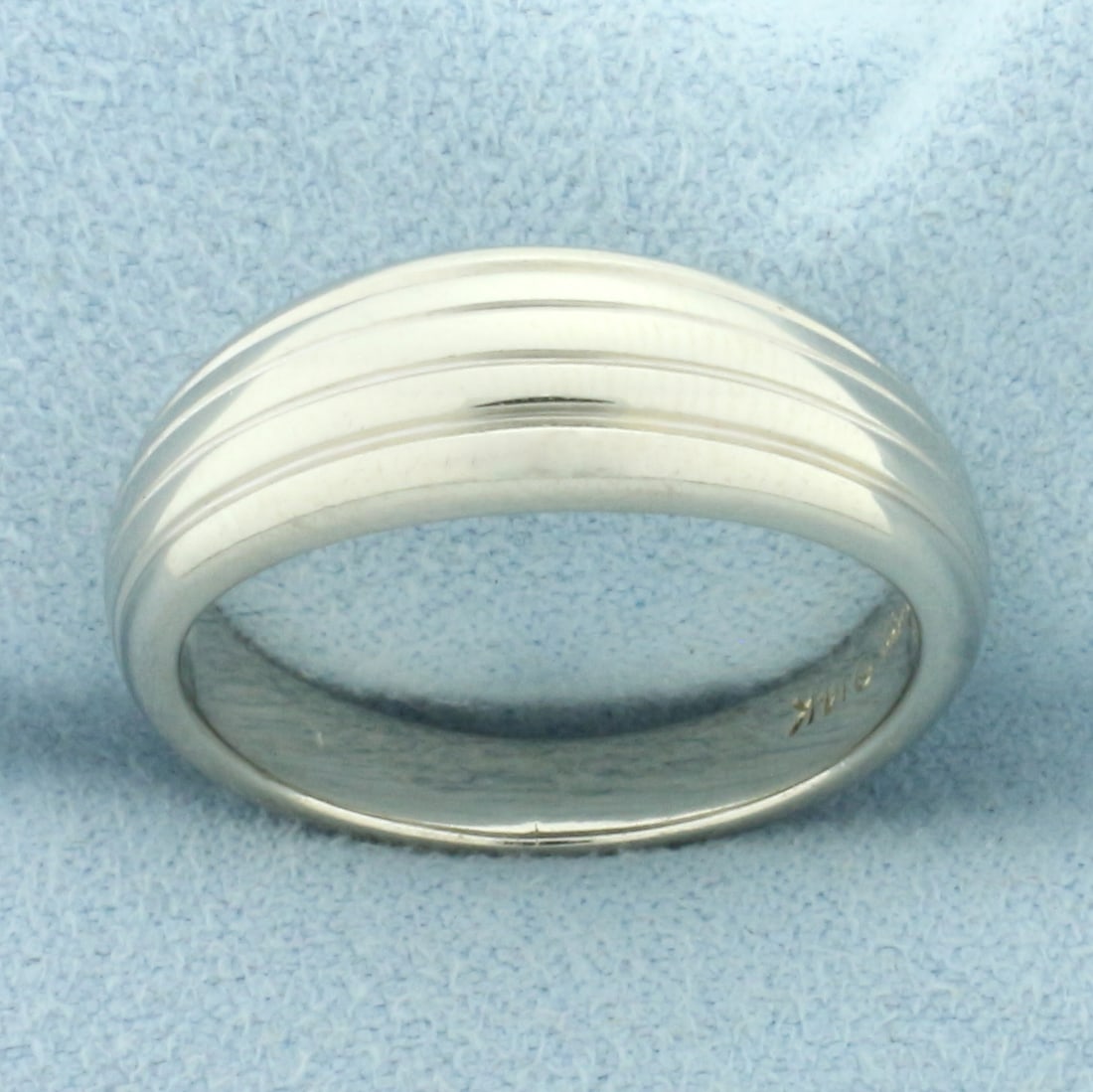 Band Design Tapered Ring in 14k White Gold: In 14k white gold. 7.5mm wide on top, tapers to 4mm in back. Size: 9. 6.4g.