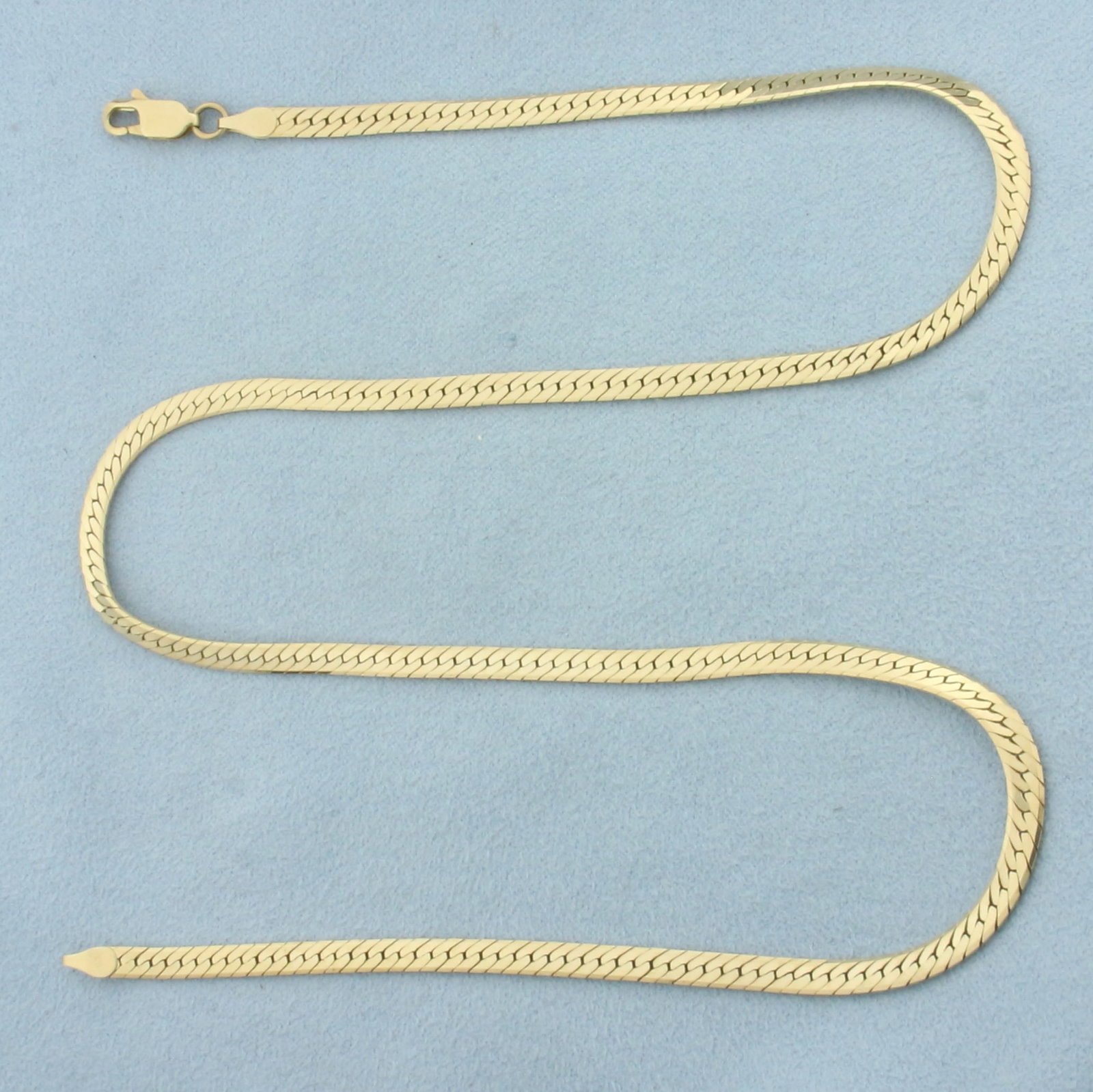 19 Inch Herringbone Link Chain Necklace in 14k Yellow Gold: In 14k Yellow Gold. 19 inch long. 3.5mm wide. Lobster clasp. 11.2g.
