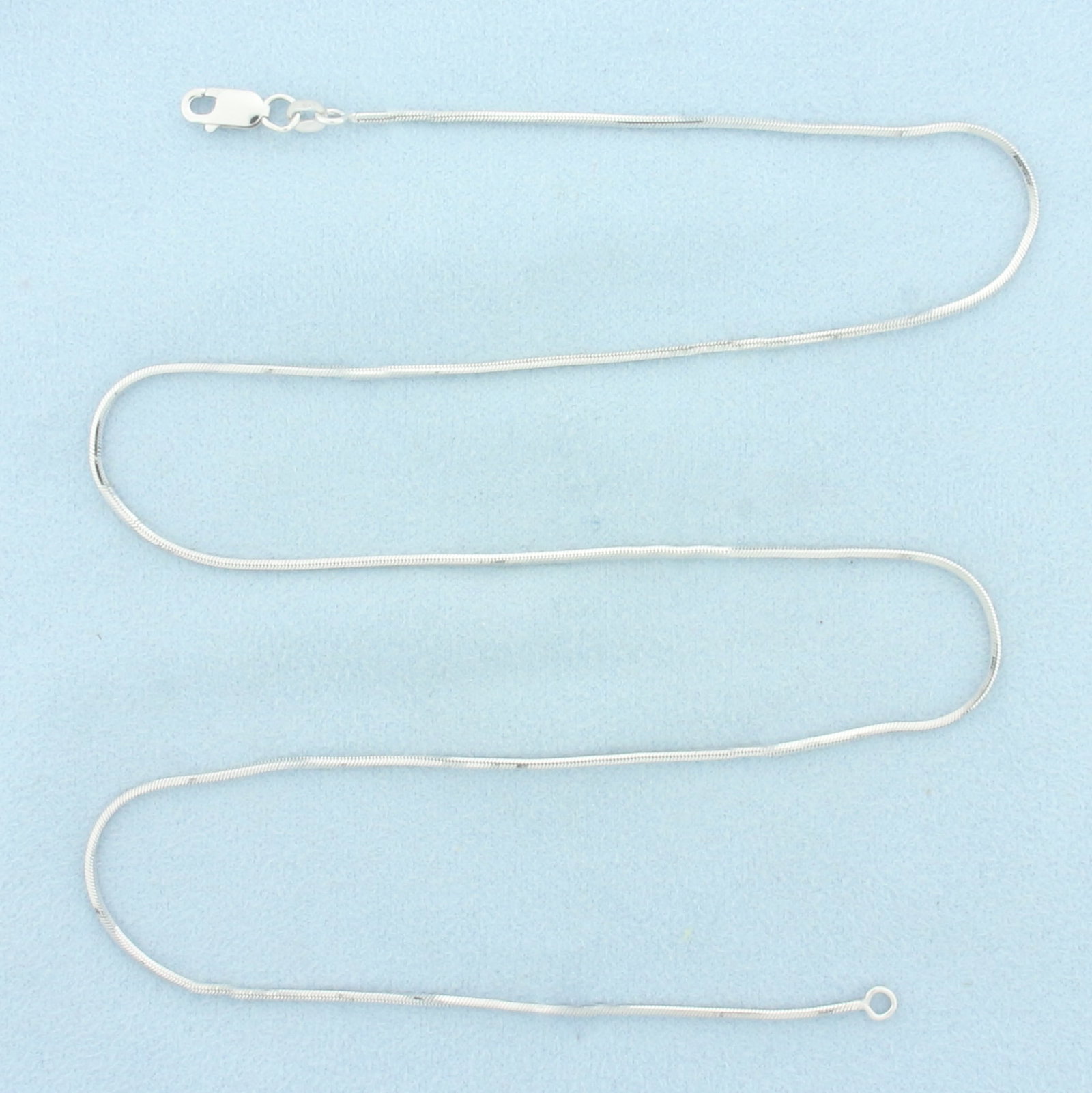 20 Inch Squared Snake Link Chain Necklace in 14k White Gold: In 14k White Gold. 20 inches long. 1.2mm wide. Lobster clasp. 6.0g.