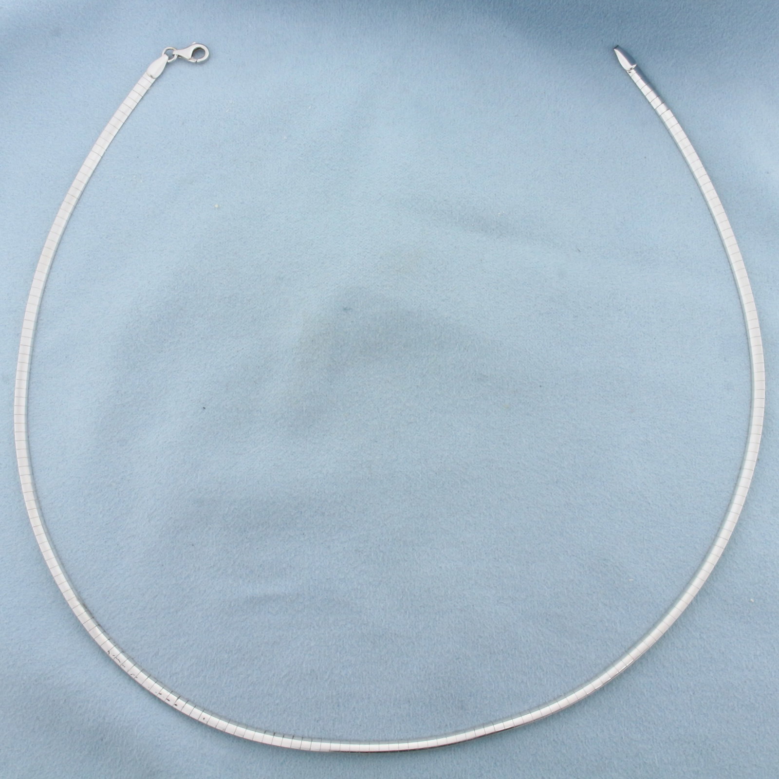 Italian 17 Inch Reversible Omega Link Necklace in 14k Yellow and White Gold: In 14k Yellow and White Gold. 17 inches long. 3mm wide. Italian made. Reversible - yellow gold on one side, white gold on other side. Lobster clasp. 11.1g.