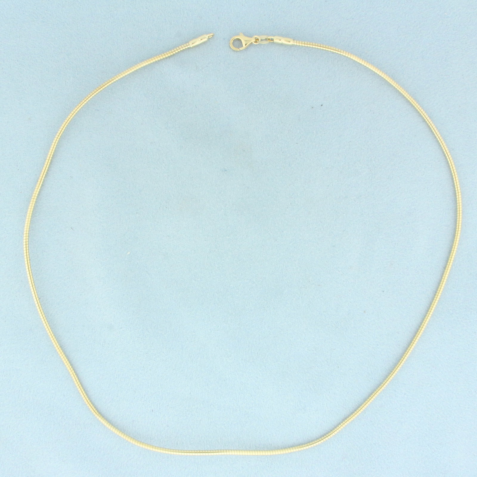 Italian 17 Inch Snake Link Chain Necklace in 14k Yellow Gold: In 14k Yellow Gold. 17 inches long. 1.6mm wide. Italian made. Lobster clasp. 9.6g.