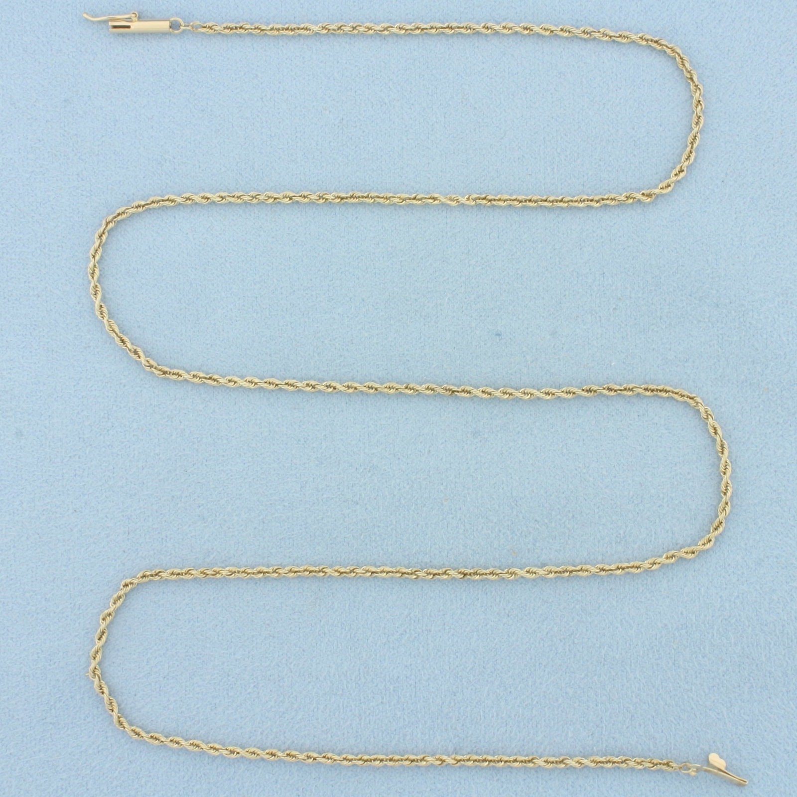 20 Inch Rope Link Chain Necklace in 14k Yellow Gold: In 14k Yellow Gold. 20 inches long. 1.7mm wide. Barrel clasp with safety latch. 4.9g.