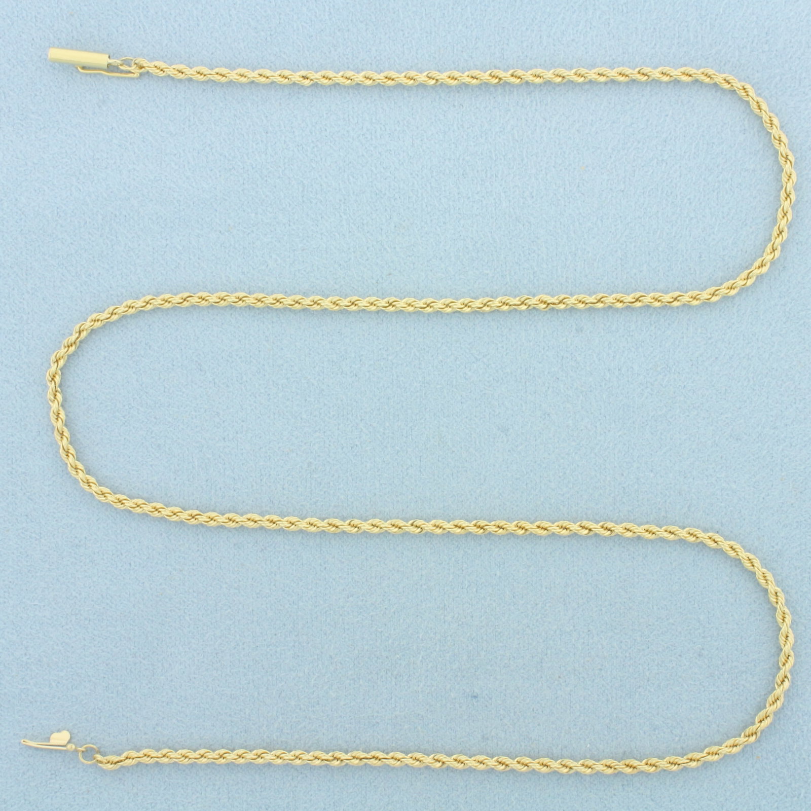 18 Inch Rope Link Chain Necklace in 18k Yellow Gold: In 18k Yellow Gold. 18 inches long. 2.1mm wide. Barrel clasp with safety latch. 8.9g.