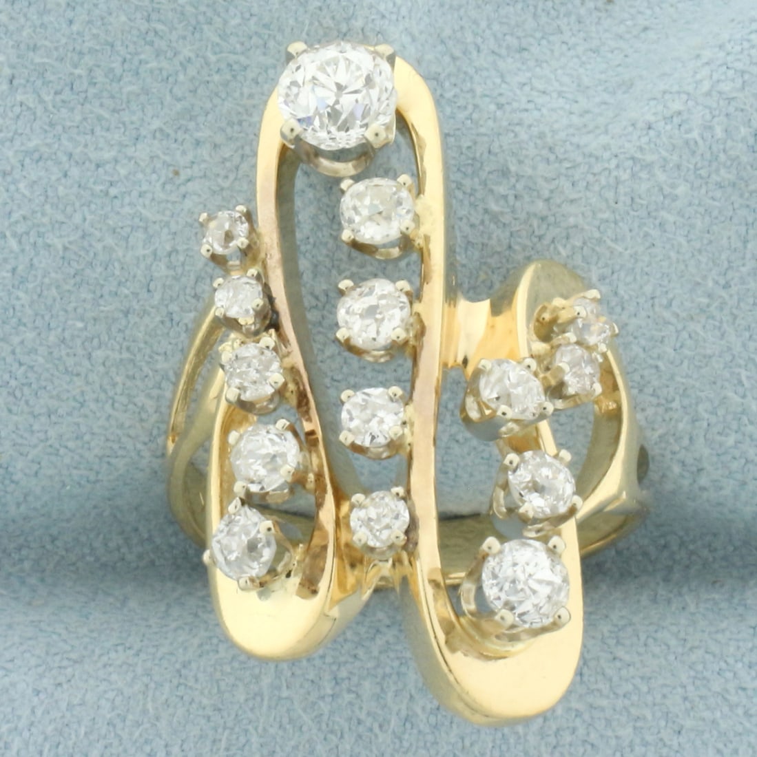 Antique Diamond Abstract Design Swirl Ring in 14k Yellow Gold: In 14k yellow gold. Contains one 1/2ct high quality Old European cut diamond, VS clarity/G color. Also contains fourteen high quality diamonds, 1ct TW, of similar high quality. 1.5ct TW. Size: 6.5. 7.
