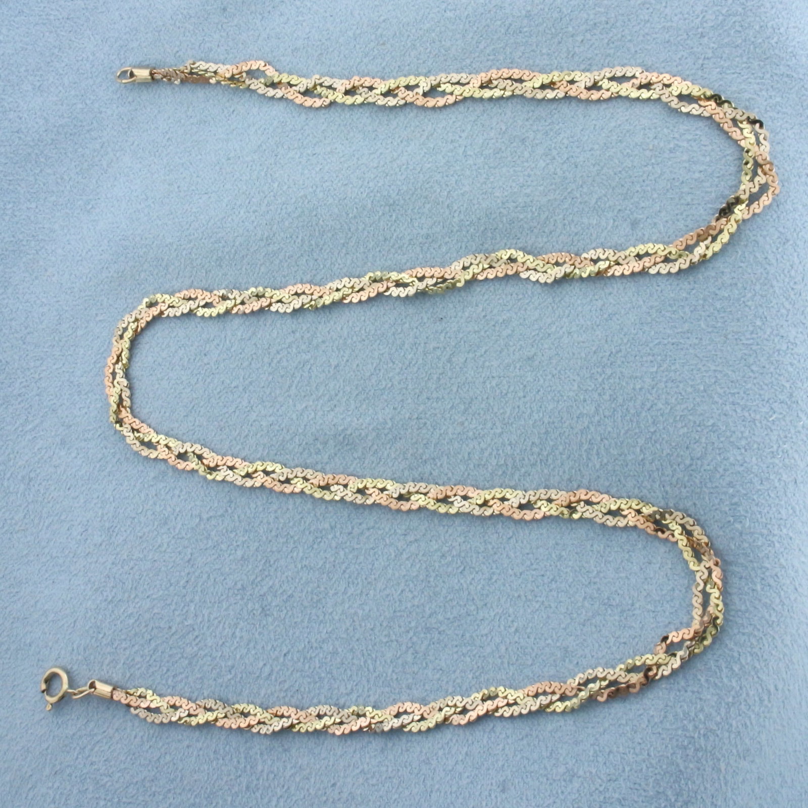 Tri-Color Braided S-Link Choker Necklace in 14k Yellow, White, and Rose Gold: In 14k Yellow, White, and Rose Gold. 16 inches long. 3.5mm wide. Spring clasp. 6.4g.