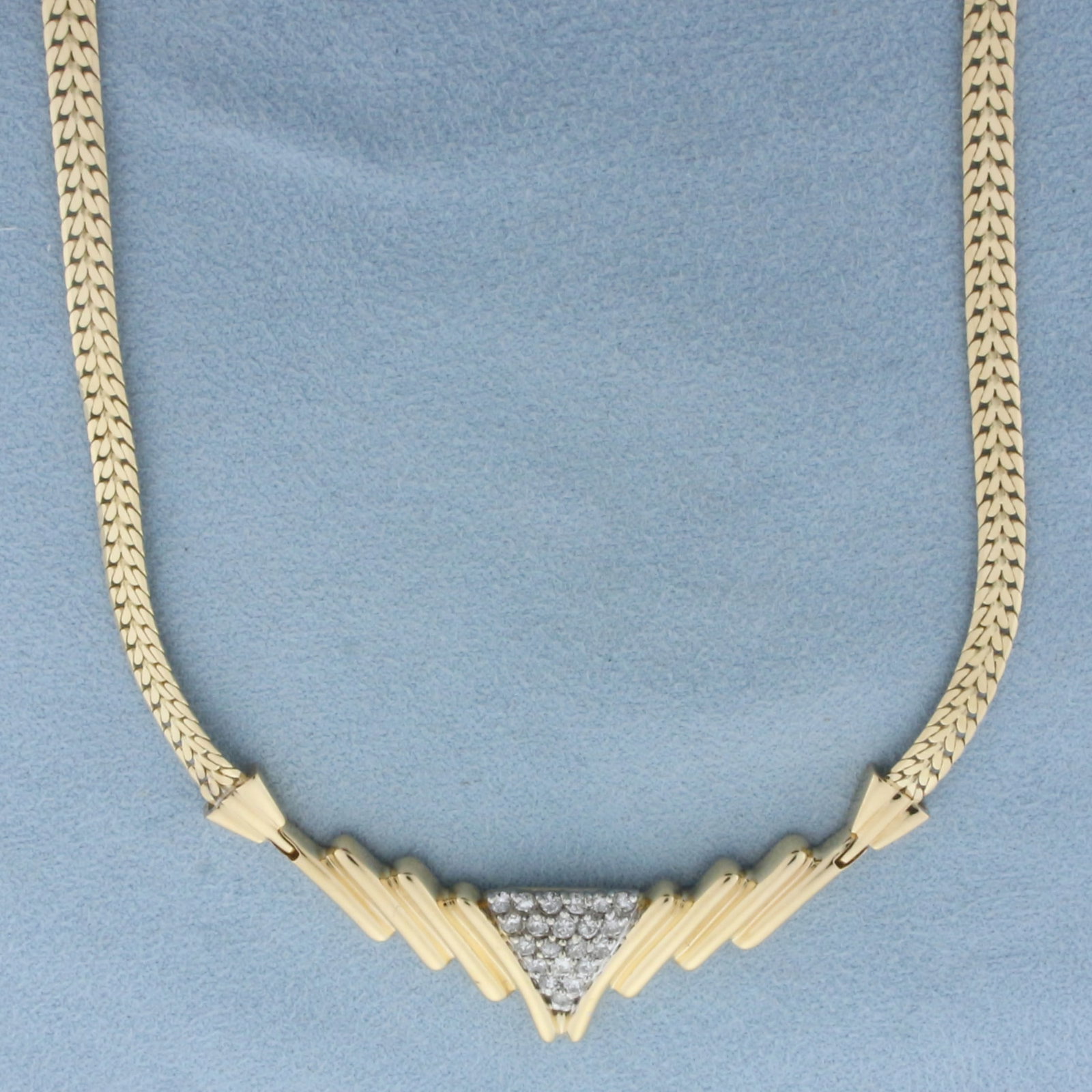 Pave Diamond V Necklace in 14k Yellow Gold: In 14k Yellow Gold. Contains twenty-one high quality diamonds, 1/2ct TW, SI clarity/H color. 18 inches long. 4mm wide chain. Slide clasp with safety latch. 17.5g.