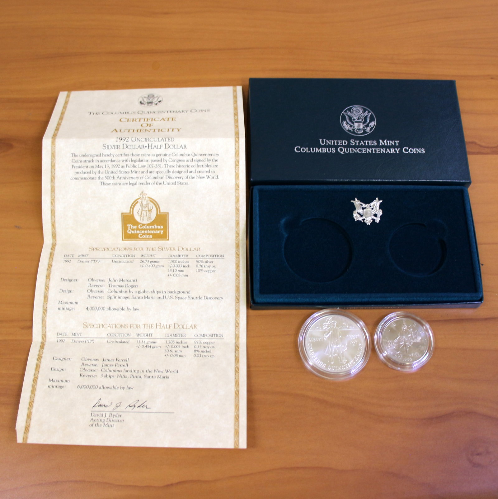 US Mint Columbus Quincentenary Uncirculated Coin Set OGP: Contains one 1992 90% Silver Uncirculated Columbus Quincentenary Silver Dollar. Also contains one 1992 Uncirculated Columbus Quincentenary Half Dollar. Set in original government packaging and contain