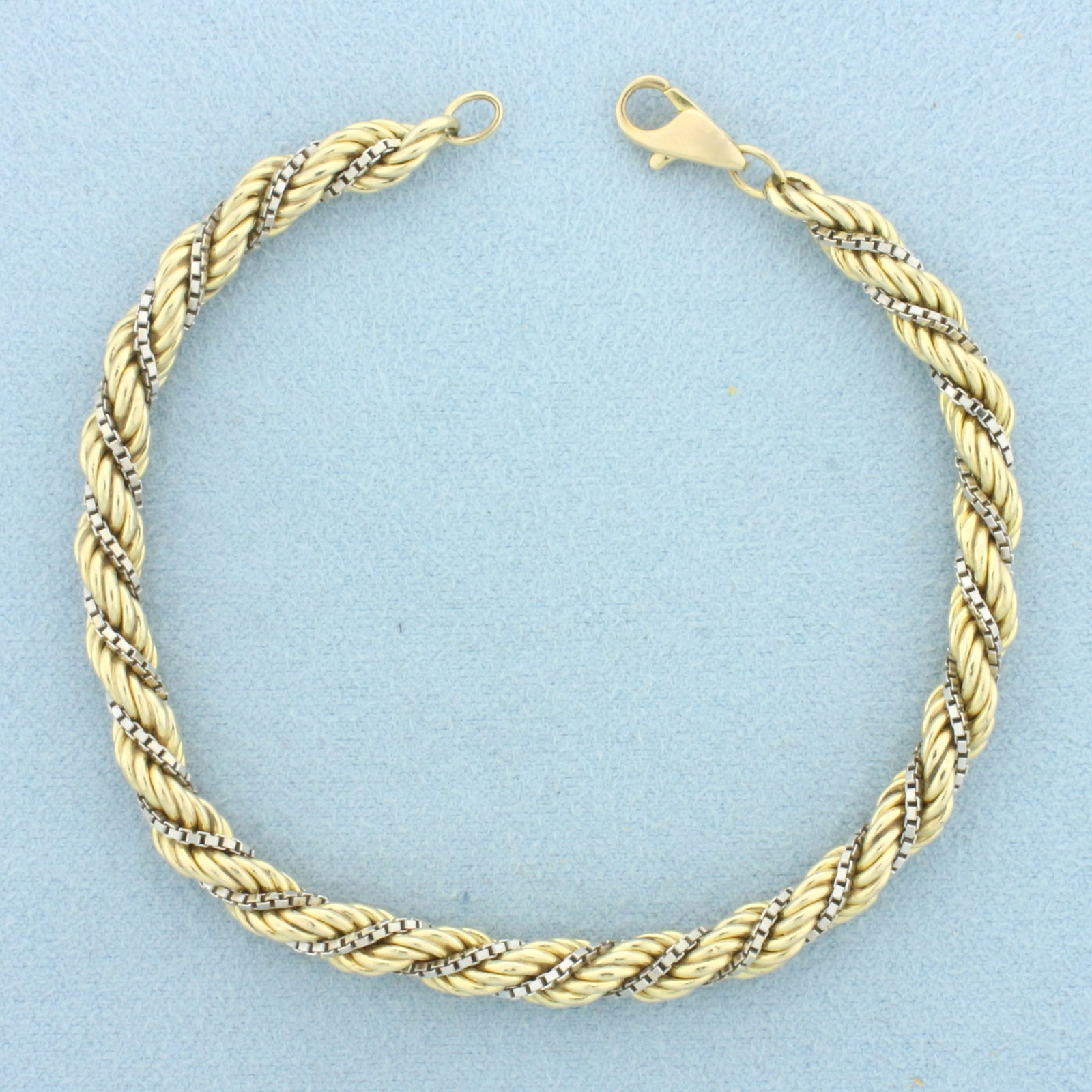Two Tone Box and Rope Link Bracelet in 14k Yellow and White Gold: In 14k Yellow and White Gold. 7 3/4 inches long. 5.1mm wide. Lobster clasp. 8.9g.