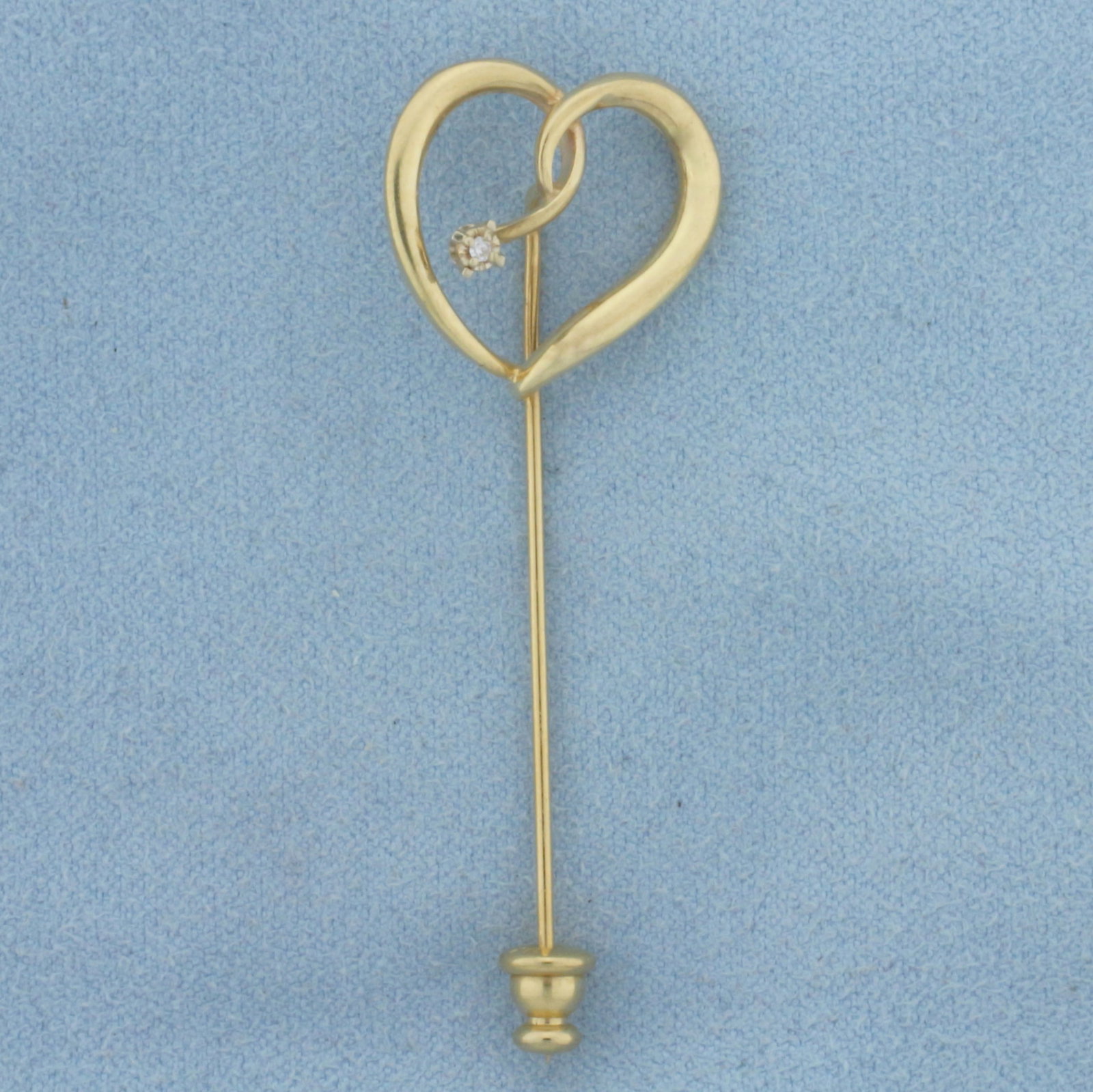 Vintage Diamond Heart Pin in 14K Yellow Gold: In 14K Yellow Gold (stopper gold plated). Contains a high quality .01ct round diamond, SI clarity/H color. 2 inch long pin and stopper. 2.8g