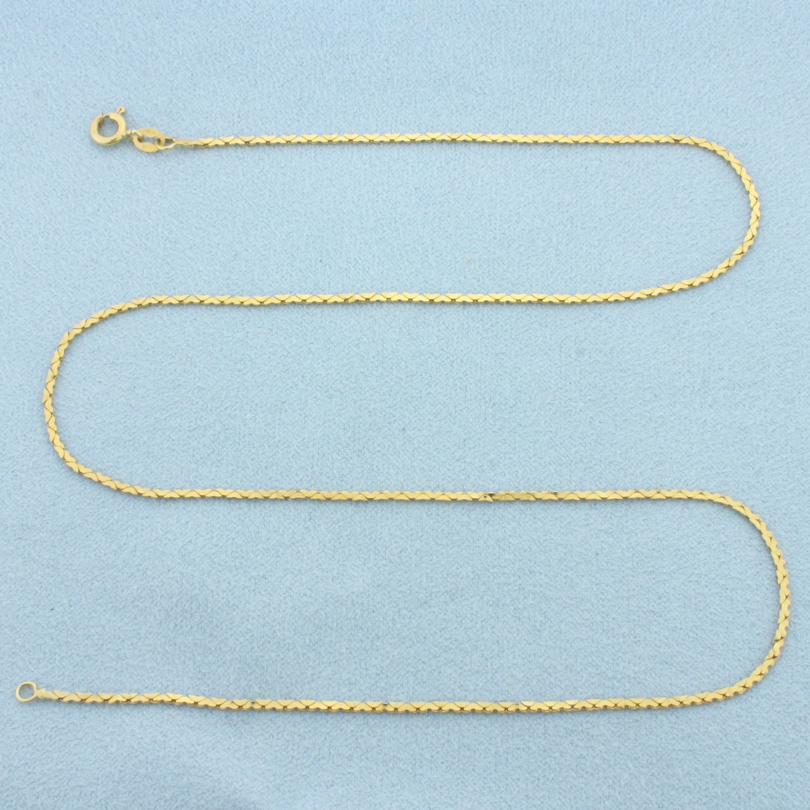 16 Inch Italian Heart Link Chain Necklace in 14k Yellow Gold: In 14k Yellow Gold. 16 inches long. 1.3mm wide. Made in Italy. Spring clasp. 2.3g.