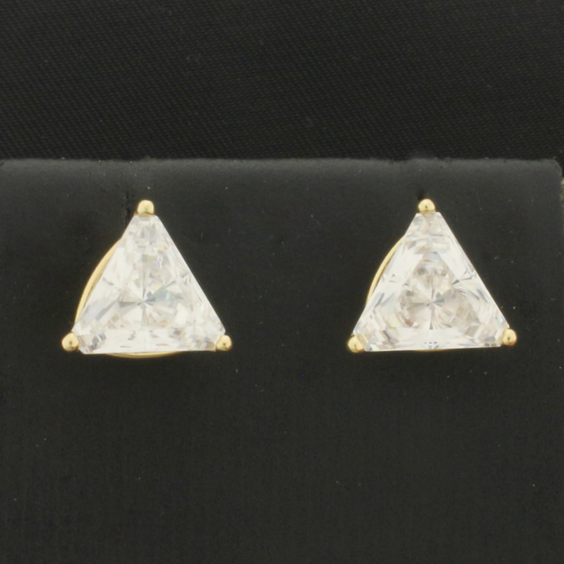 Large Trillion CZ Screw Back Stud Earrings in 14k Yellow Gold: In 14k Yellow Gold. Contains two 10mm high quality trillion cut Cubic Zirconia gemstones with excellent cut and clarity for added brilliance. Screwbacks. 3.8g.