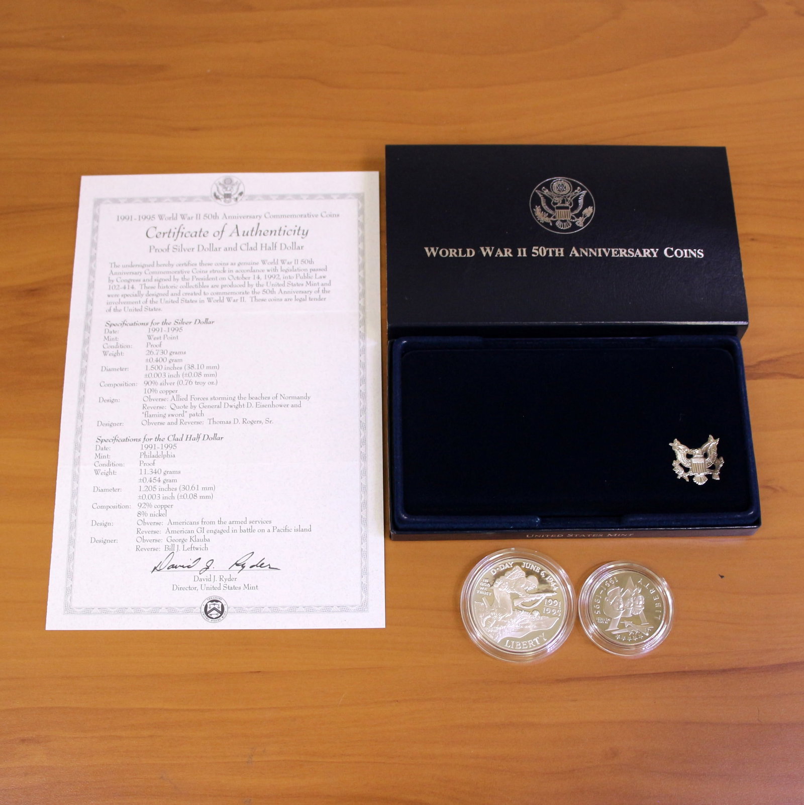 US Mint World War 2 Anniversary Silver Proof Coin Set OGP: Contains one 1991-1995 United States Mint 90% Silver Commemorative Silver Dollar. Also contains one 1991-1995 Clad Half Dollar. Set in original packaging and contains certificate of authenticity.