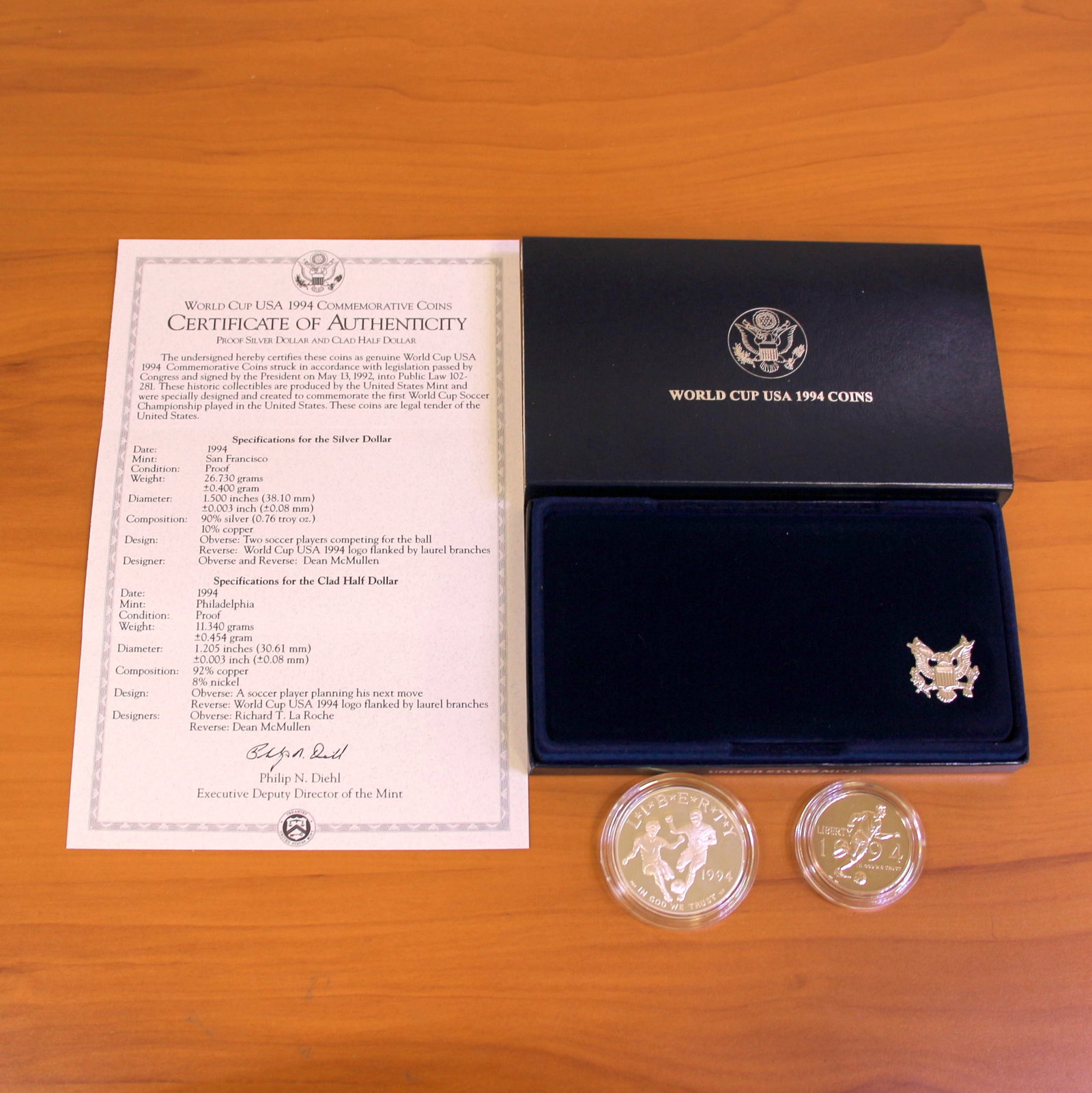 US Mint World Cup USA Silver Proof Coin Set OGP: Contains one 1994 United States 90% Silver Commemorative Silver Dollar. Also contains one 1994 Clad Half Dollar. Set in original packaging and contains certificate of authenticity.
