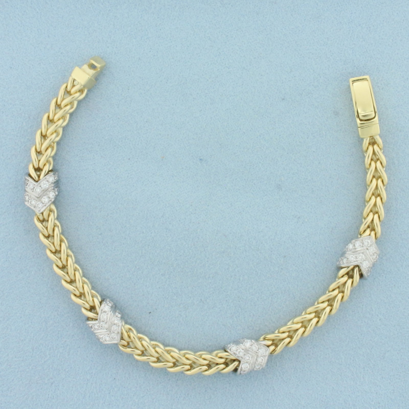 Italian Diamond Chevron Foxtail Bracelet in 14k Yellow Gold: In 14k yellow gold. Contains fifty-six high quality diamonds, 1ct TW, VS clarity/G color. Italian made. 7 inches long and 8mm wide, (at widest point). Slide in clasp. 31.3g.