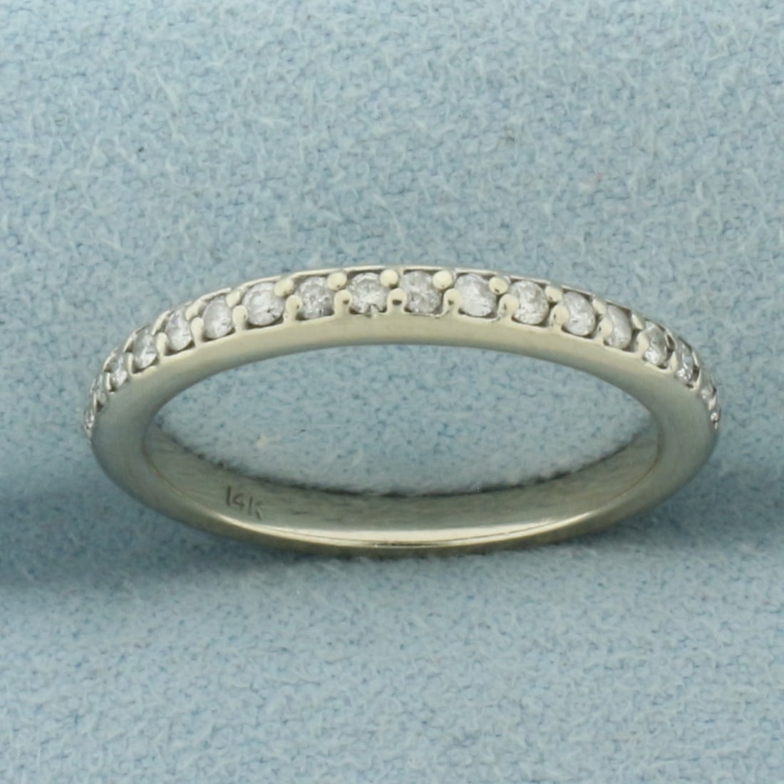 Diamond Wedding Band Ring in 14k White Gold: In 14k White Gold. Contains eighteen .01ct TW high quality diamonds, SI clarity/H color. 2.5mm wide. Size 6.5. 2.7g.