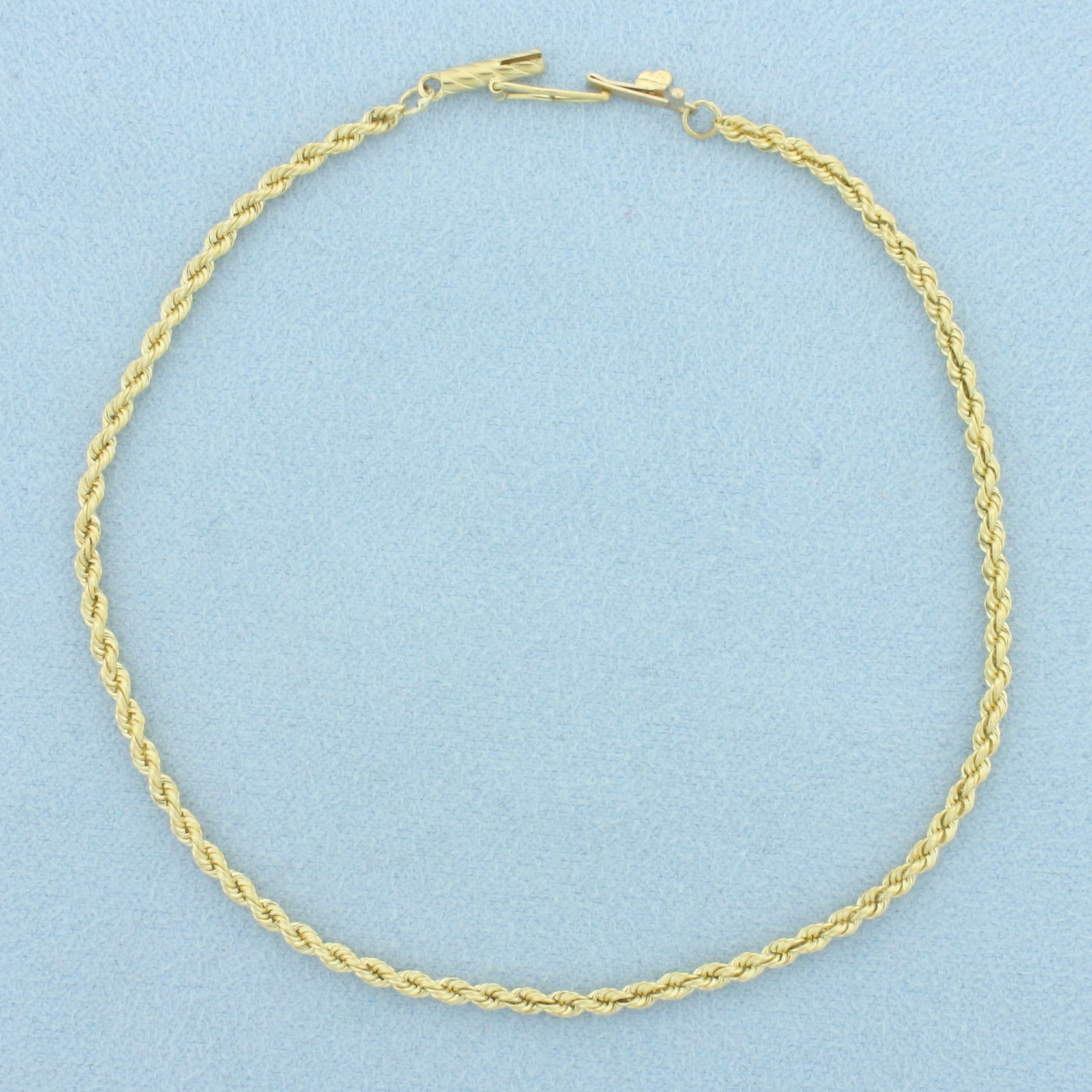 Rope Link Anklet in 18k Yellow Gold: In 18k Yellow Gold. 8 5/8 inches long. 2.2mm wide. Barrel clasp with safety latch. 4.7g.