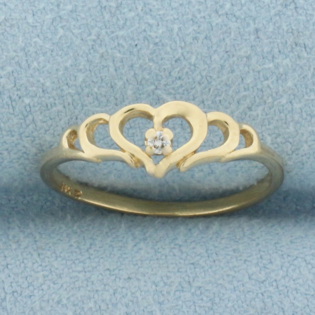Diamond Heart Ring in 14k Yellow Gold: In 14k Yellow Gold. Contains one .01ct high quality diamond. 5.7m wide at widest spread. Size 5.5. 1.1g.