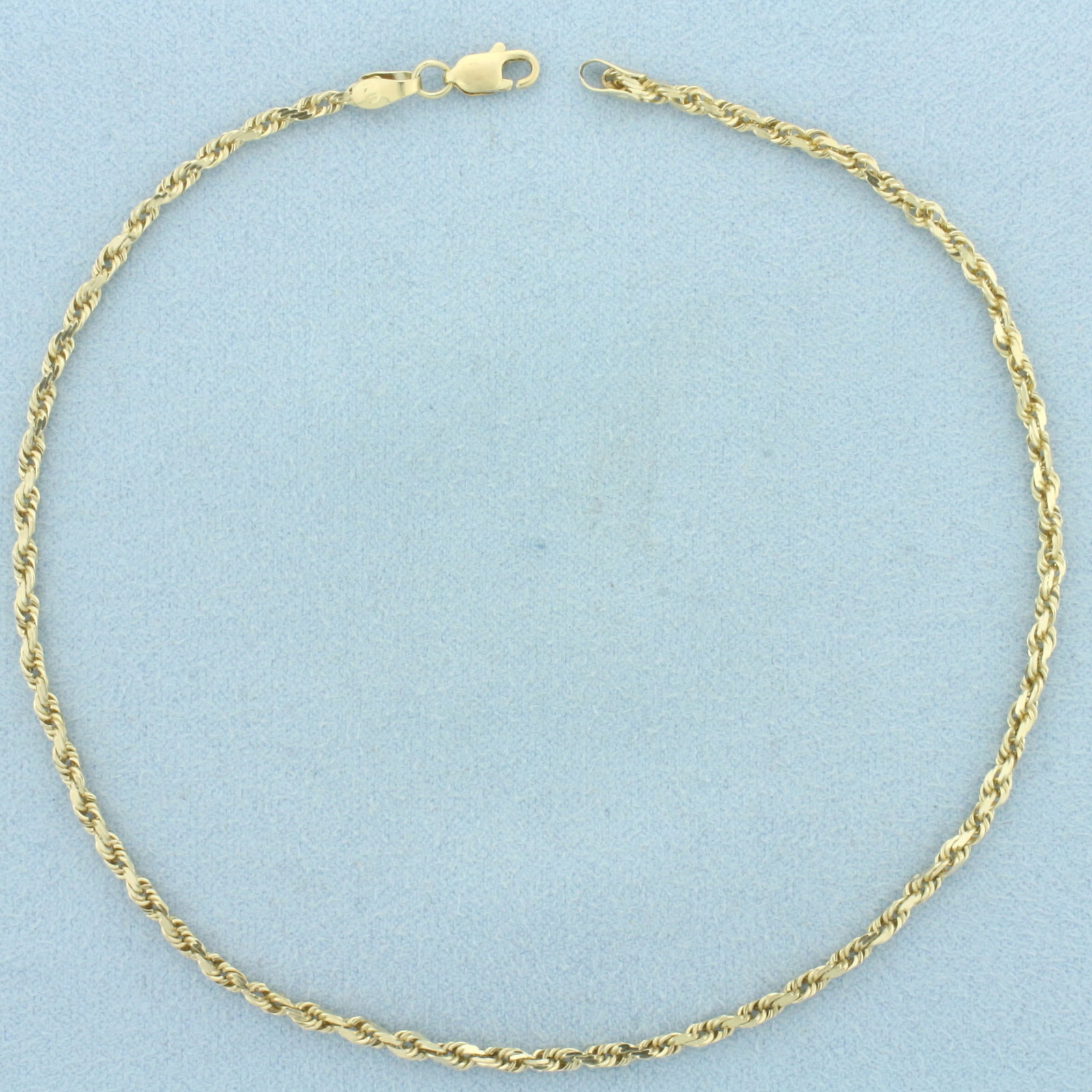Rope Link Anklet in 10k Yellow Gold: In 10k Yellow Gold. 10 3/4 inches long. 2mm wide. Lobster clasp. 3.9g.