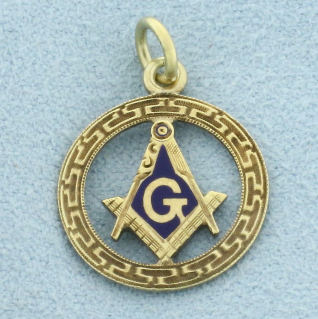 Vintage Masonic Charm in 14k Yellow Gold: In 14k Yellow Gold. 3/4 inch long. 5/8 inch wide. Enamel details. 1.7g.