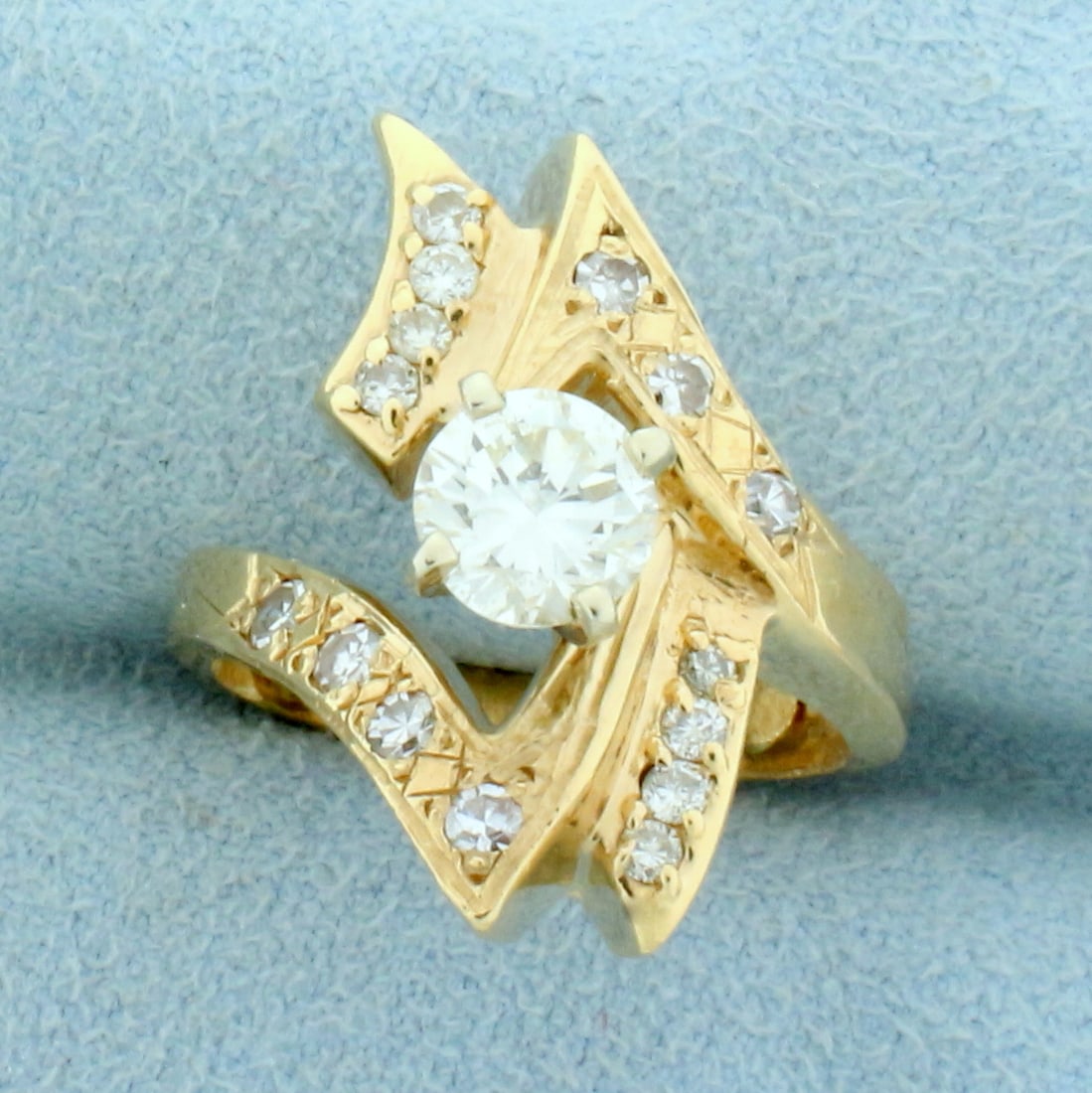Designer Abstract Modern Design Engagement Ring in 14K Yellow Gold: In 14K Yellow Gold with rose colored undertones. Contains one high quality .85ct center and fifteen .03ct side Diamonds, 1.25ct TW, VS1 clarity/I color, great cut for lots of sparkle. Size 5. 7.6g