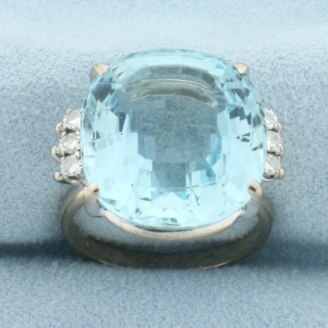 Aquamarine and Diamond Statement Ring in 18k White Gold: In 18k White Gold. Contains one AAA quality natural 17.8mm x 16.4mm cushion cut Aquamarine gemstone, approximately 15 cts, with extremely vibrant color and excellent clarity. Also contains six high