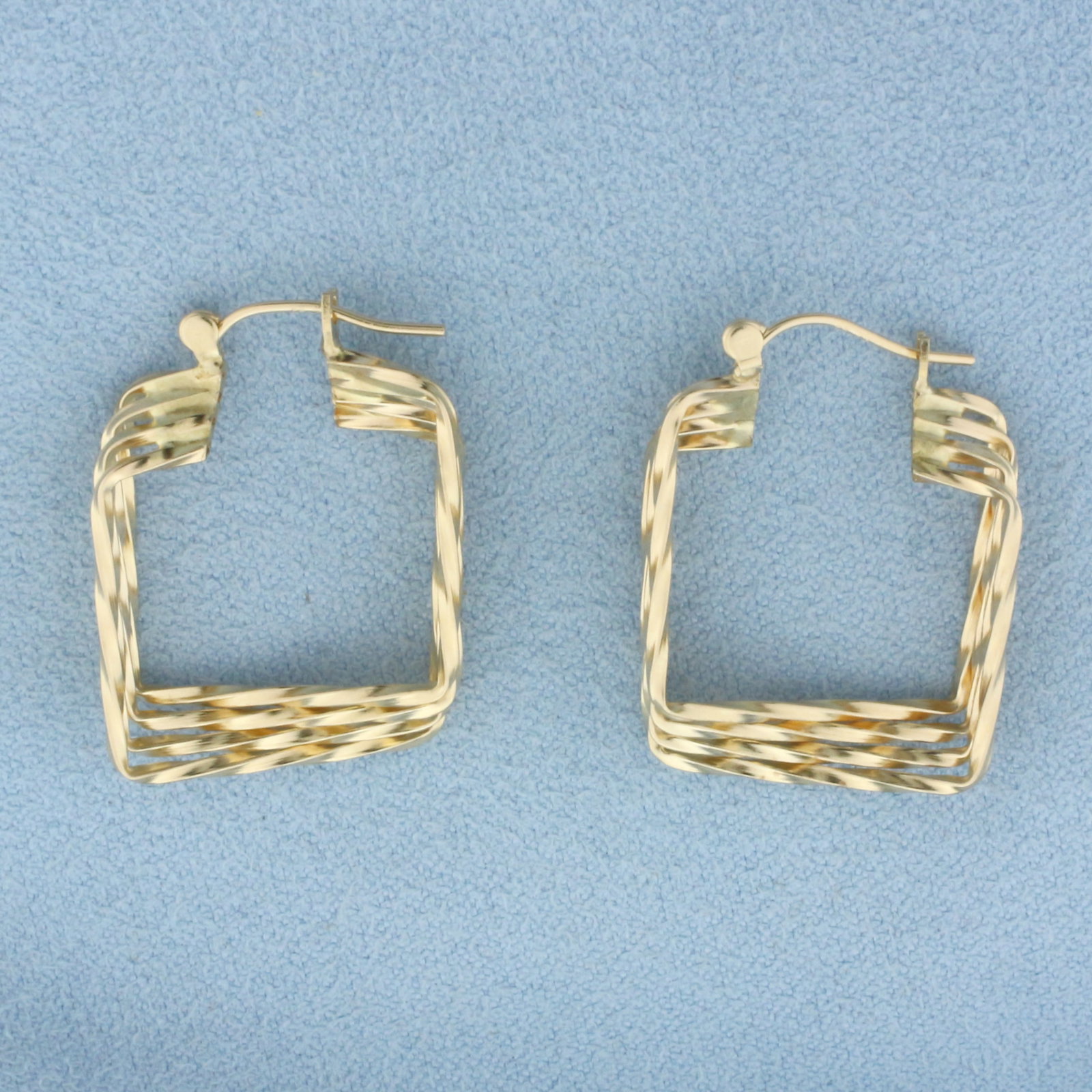 Square Hoop Earrings in 14k Yellow Gold: In 14k Yellow Gold. 1 inch long. 3/4 inch wide. 3.3g.