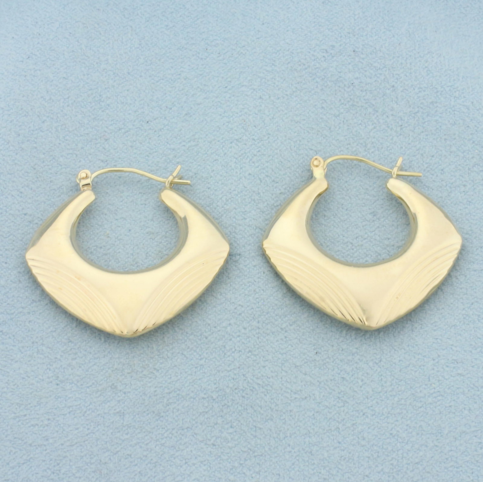 Deco Style Squared Hollywood Regency Hoop Earrings in 14k Yellow Gold: In 14k Yellow Gold. 1 1/8 inches long. 1 1/8 inches wide. 3.1g.