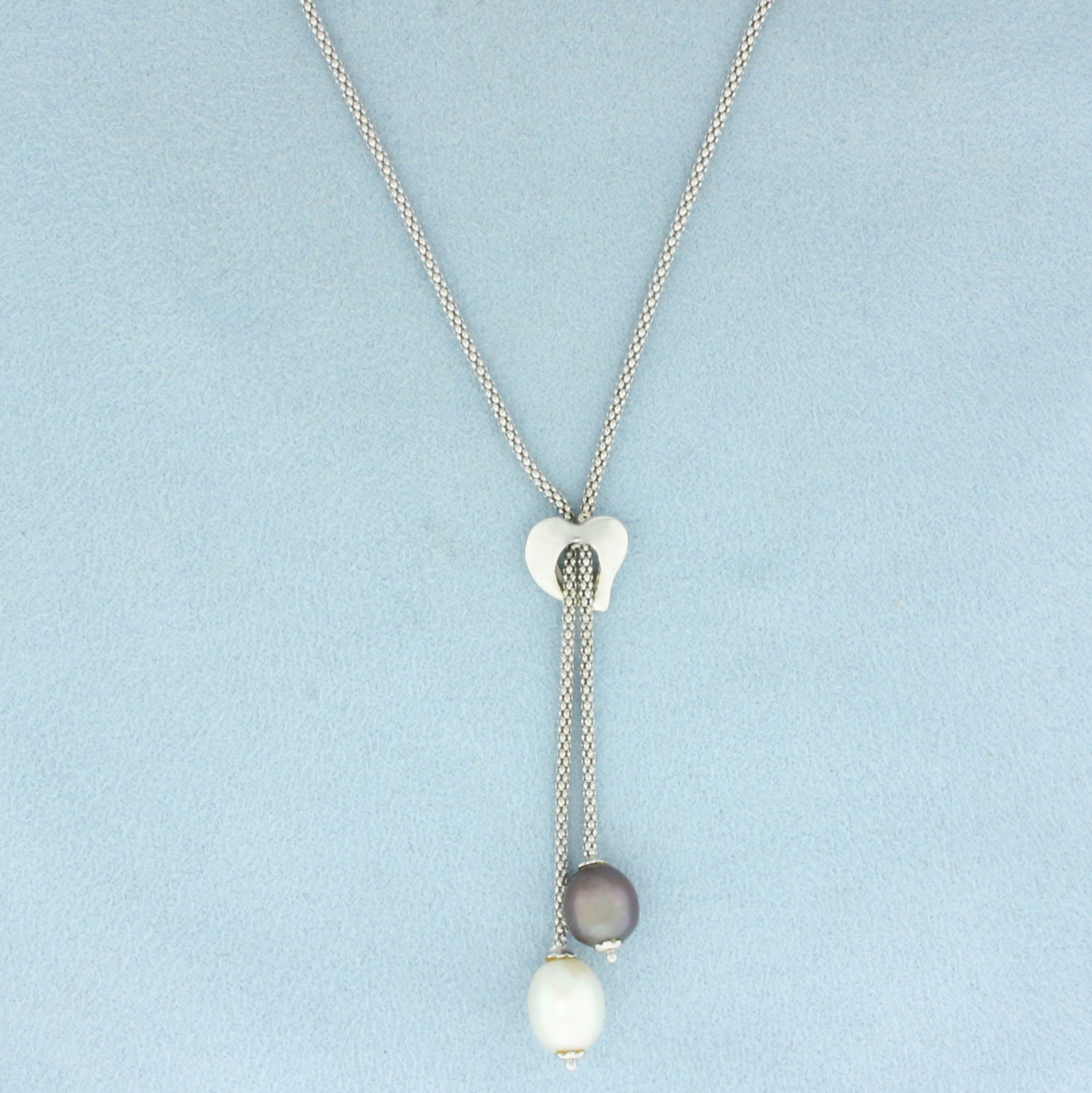 Cultured Tahitian and White Pearl Dangle Lariat Popcorn Necklace in 14k White Gold: In 14k White Gold. Contains one 10.5mm high quality white cultured pearl with high luster. Also contains one 8mm high quality Tahitian pearl with peacock undertone and high luster.19 inches long. 1.5m