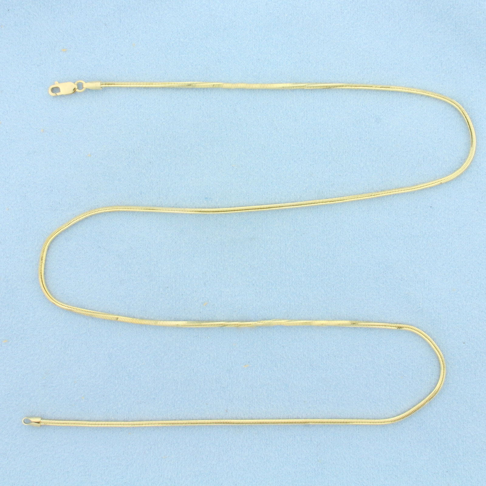 20 Inch Italian Snake Link Chain Necklace in 14k Yellow Gold: In 14k Yellow Gold. 20 inches long. 1.7mm wide. Italian made. Lobster clasp. 9.0g