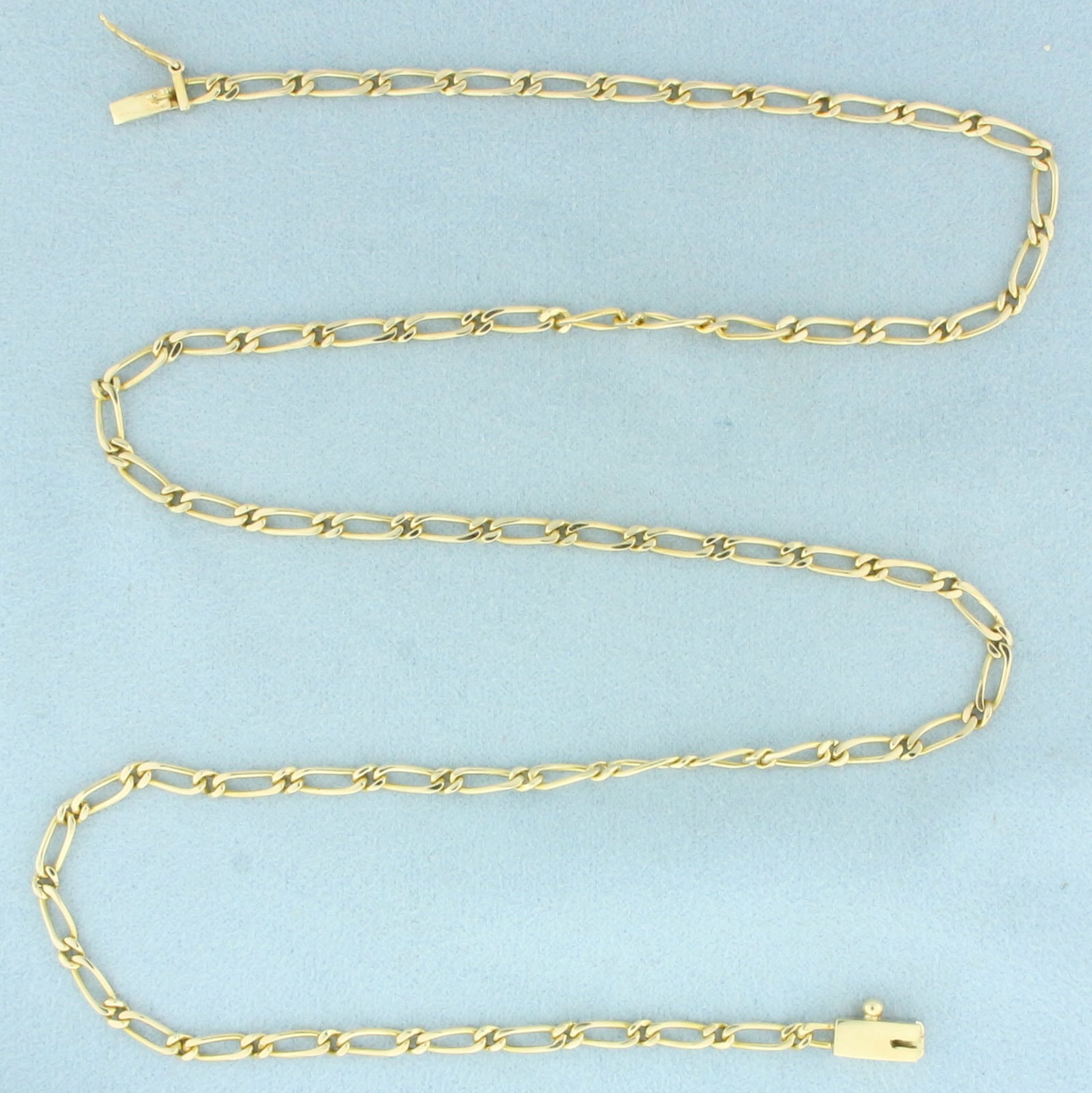 22 Inch Fancy Paperclip Link Chain Necklace in 14k Yellow Gold: In 14k Yellow Gold. 22 inches long. 3mm wide. Slide clasp with safety latch. 13.3g.