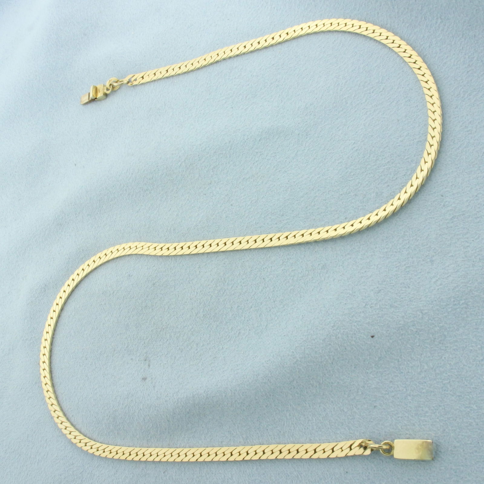 15.5 Inch Choker Herringbone Link Chain Necklace in 14k Yellow Gold: In 14k Yellow Gold. 15 1/2 inches long. 3.2mm wide. Slide clasp. 13.3g.