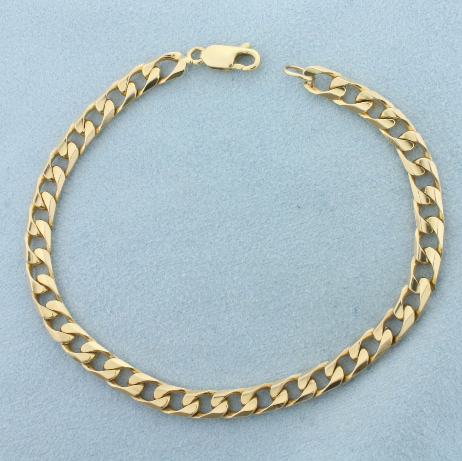 Curb Link Bracelet in 14k Yellow Gold: In 14k Yellow Gold. 8 1/8 inches long. 5mm wide. Lobster clasp. 15.2g.