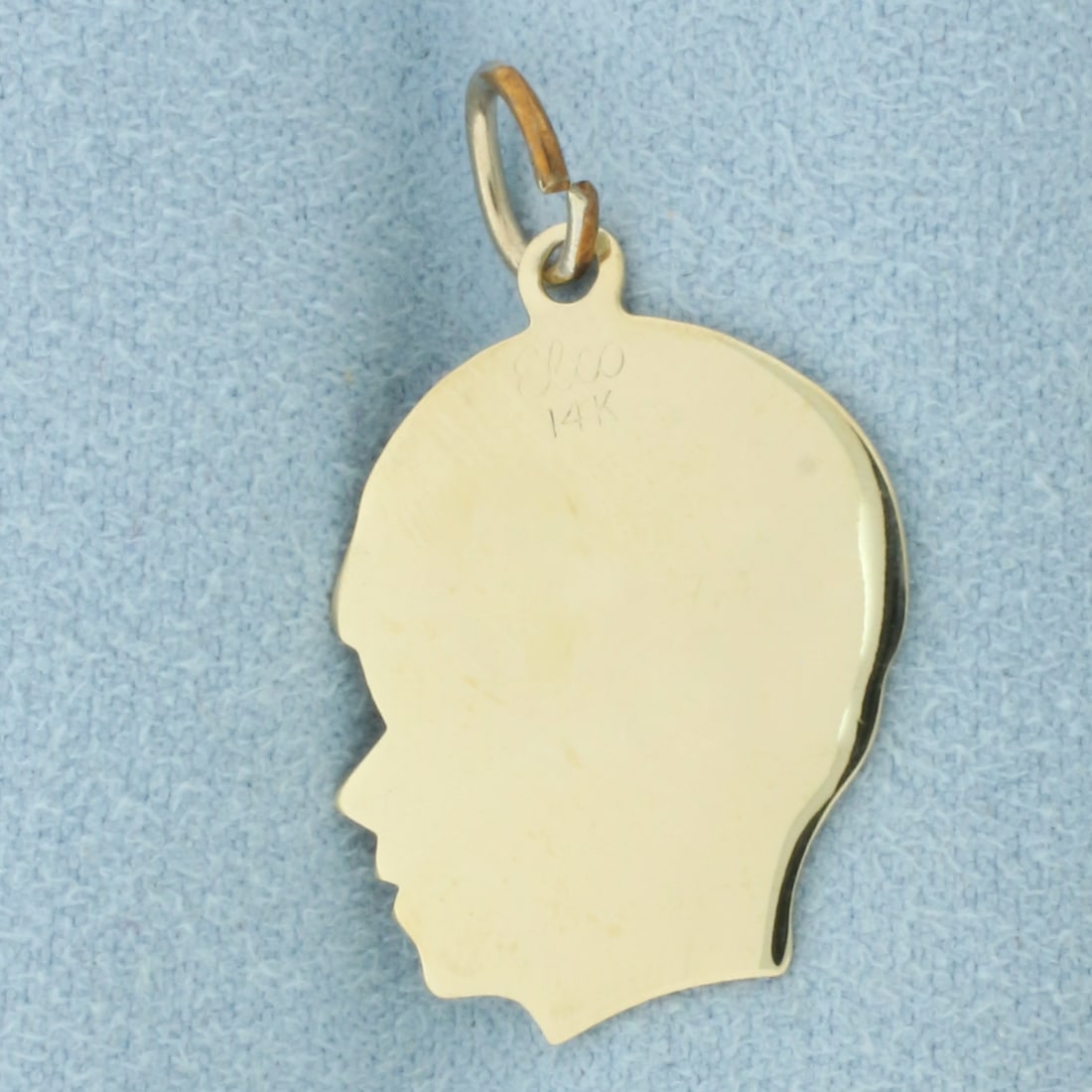 Engravable Boy Silhouette Charm in 14k Yellow Gold: In 14k Yellow Gold. 1 1/8 inch long (including jump ring). 3/4 inch wide. 1.9g.