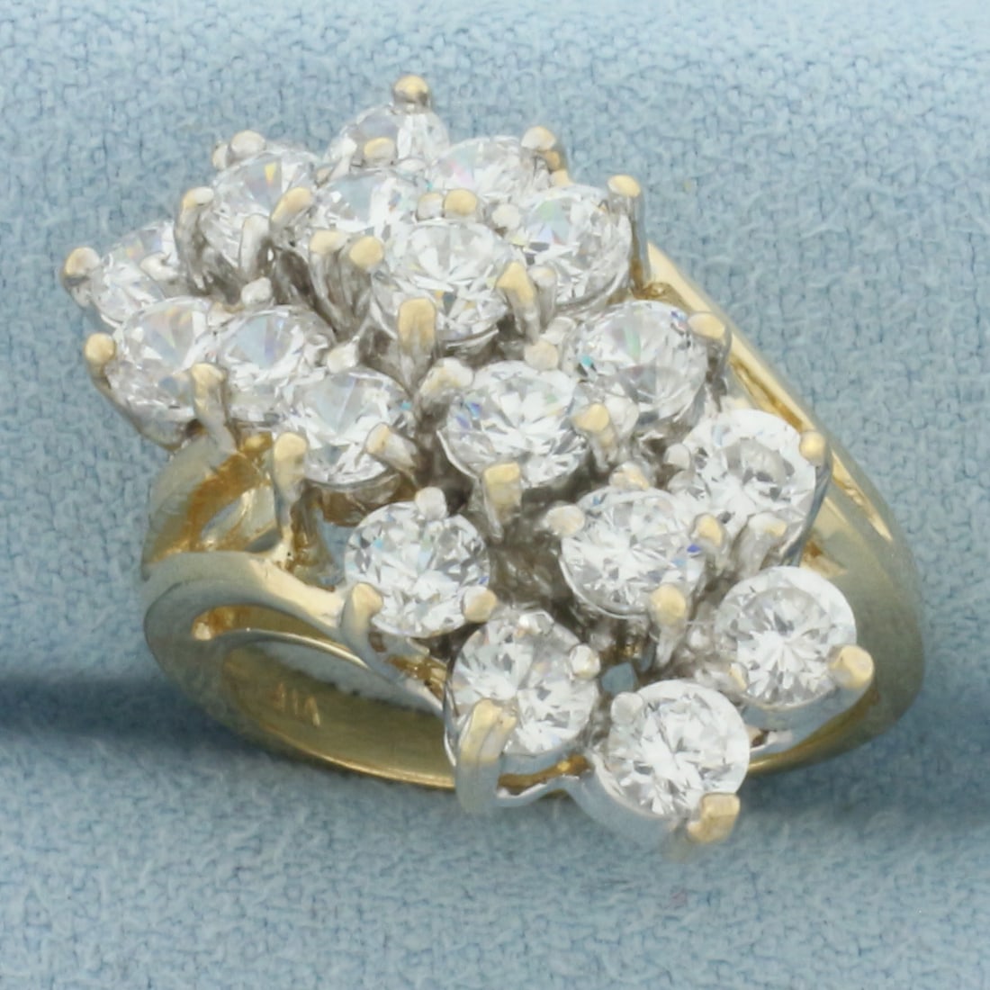 CZ Waterfall Cocktail Ring in 10k Yellow Gold: In 10k Yellow Gold. Contains nineteen 3.5mm high quality Cubic Zirconia gemstones with excellent cut and clarity for added brilliance. Size 6.5. 7.4g.