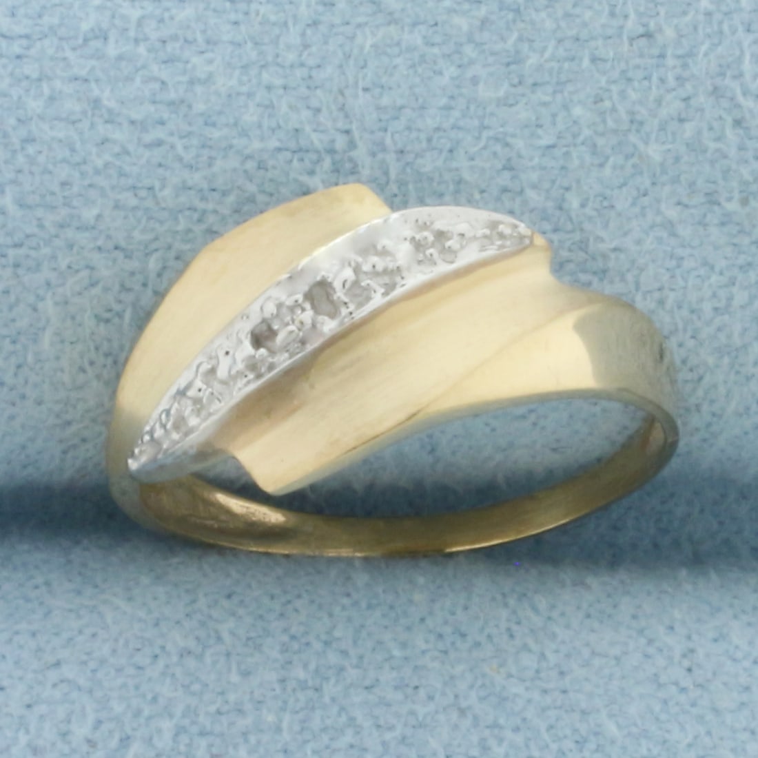 Two Tone Diamond Ring in 10k Yellow and White Gold: In 10k Yellow and White Gold. Contains one 1/2pt high quality diamond. 9mm wide at top of ring. Size 5. 1.3g.