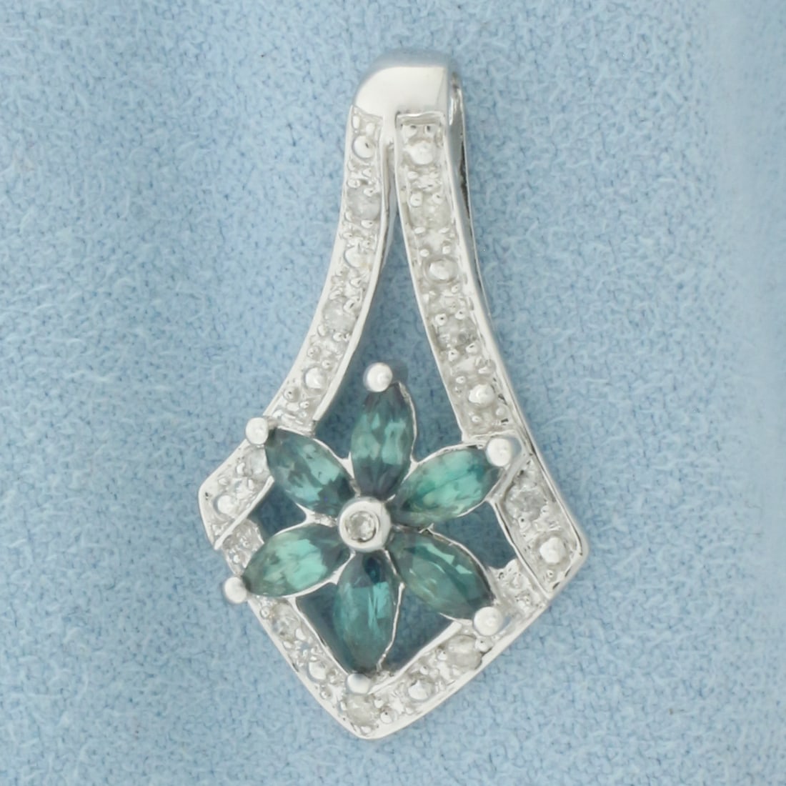 Alexandrite and Diamond Flower Pendant in 14k White Gold: In 14k white gold. 1"long x 5/8"wide. Contains six 5mm marquise cut high quality natural Alexandrite gemstones with color change from green to blue and excellent clarity. Also contains nine high quali