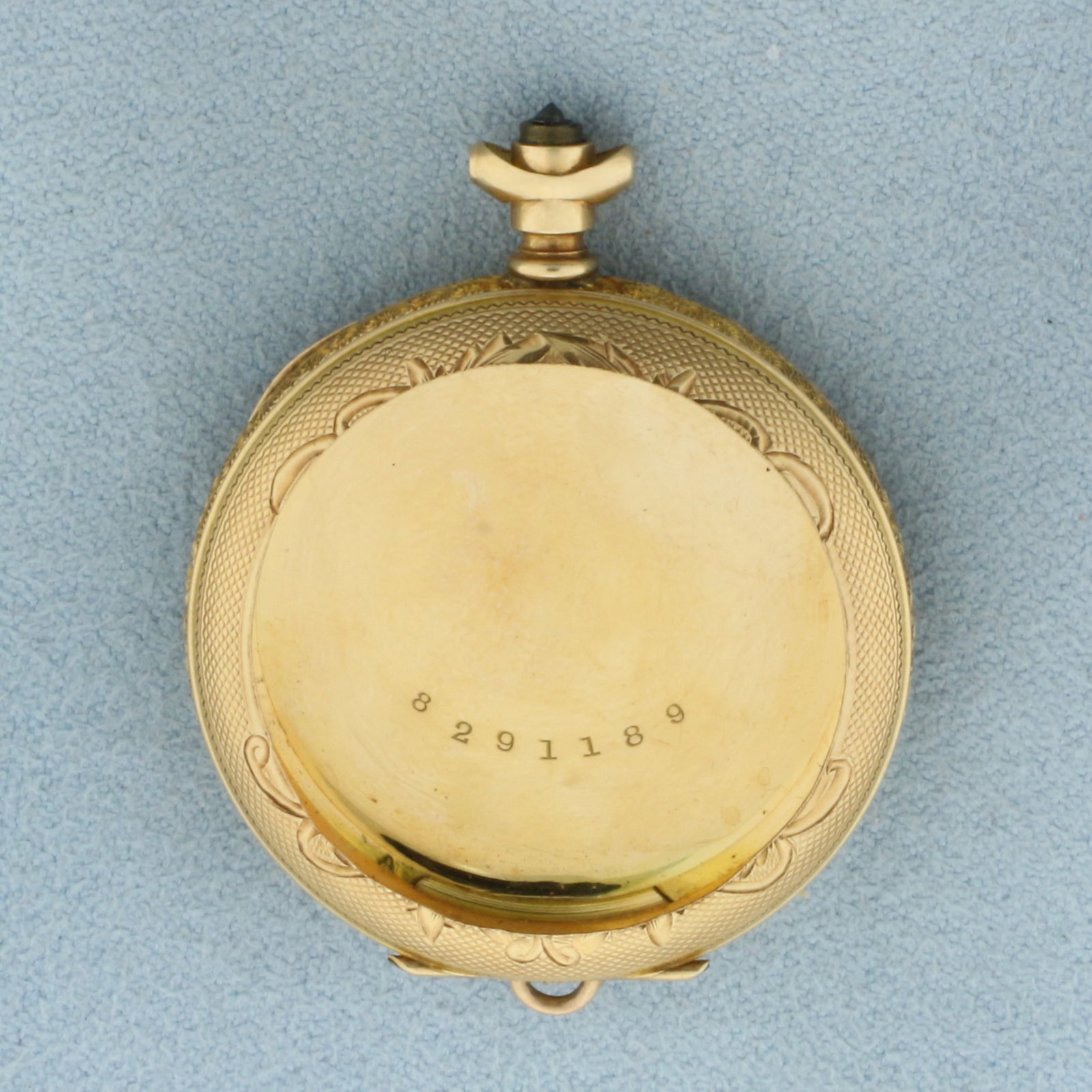 Pocket Watch Locket Case in 14k Yellow Gold: In 14k Yellow Gold. 1 5/8 inches long. 1 1/4 inch wide. 9.6g.