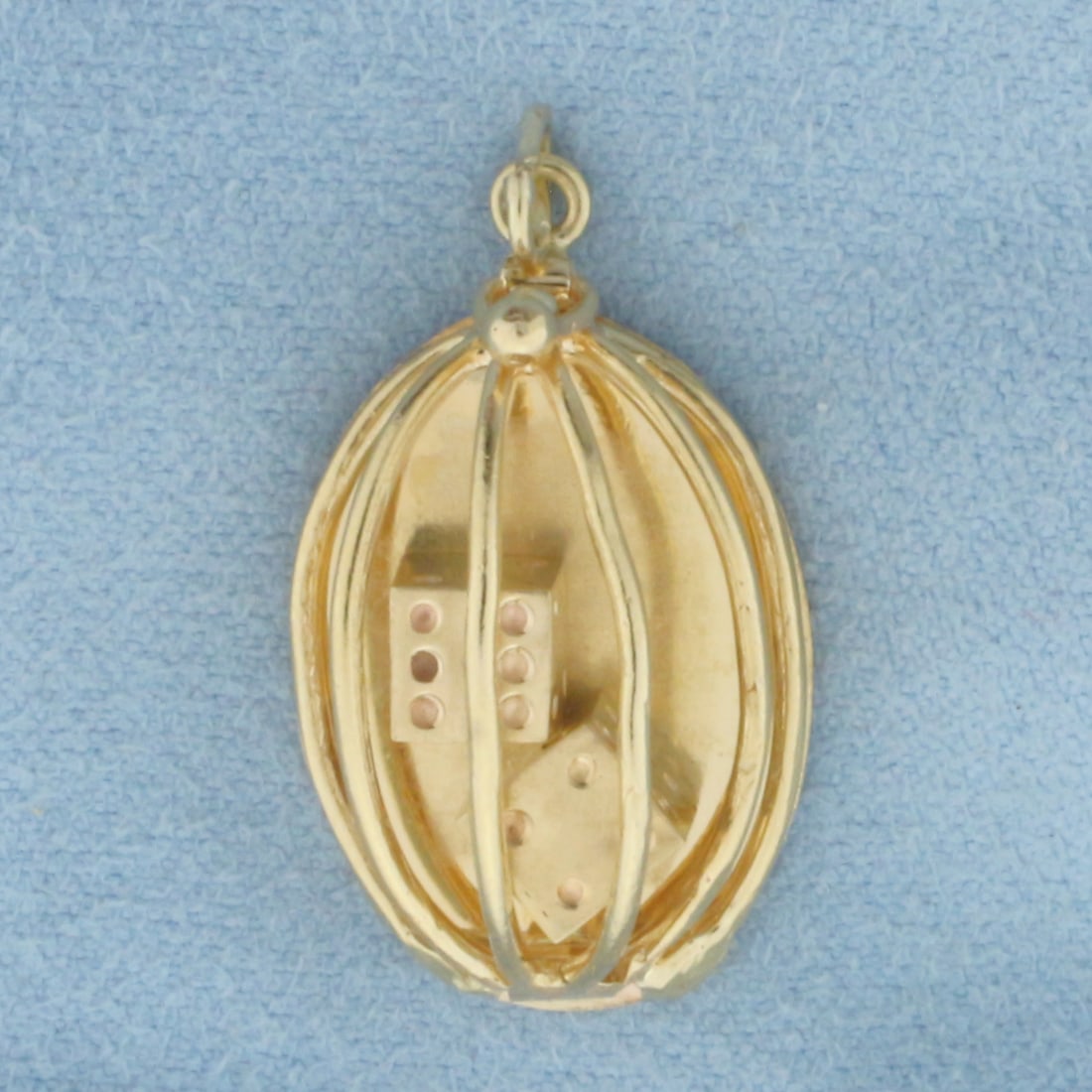 Dice in a Cage Charm or Pendant in 14k Yellow Gold: In 14k Yellow Gold. Cage opens and dice are removable from cage. Contains two 5mm gold dice. 1 1/8 inch long (including jump ring). 5/8 inch wide. 4.5g.