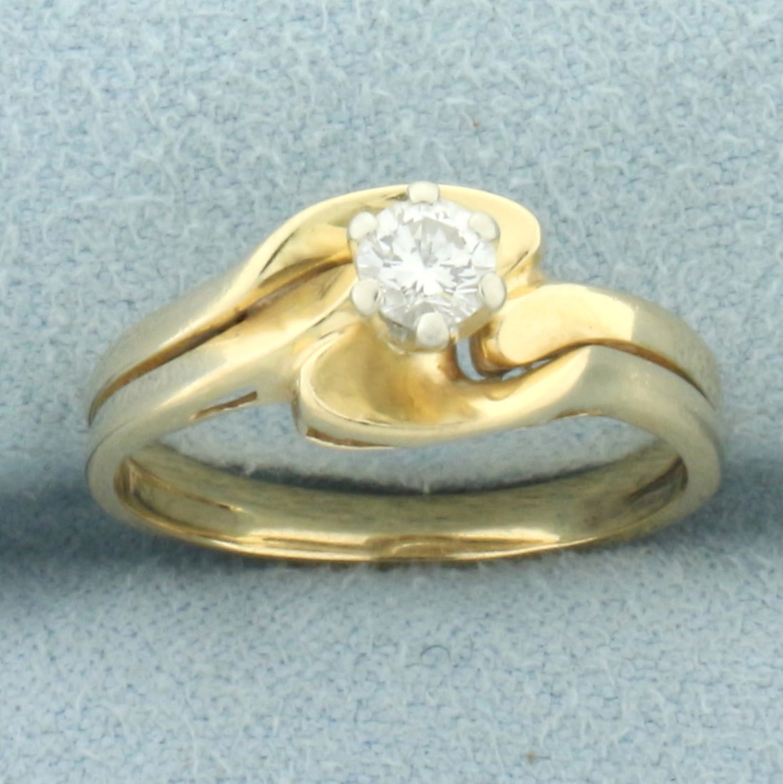 Diamond Solitaire Engagement and Wedding Ring Bridal Set in 14k Yellow Gold: In 14k yellow gold. Contains one high quality 1/4ct diamond, VS clarity/H color, great cut for lots of sparkle. Wedding band and engagement ring are soldered together. Size: 6.5. 2.7g.