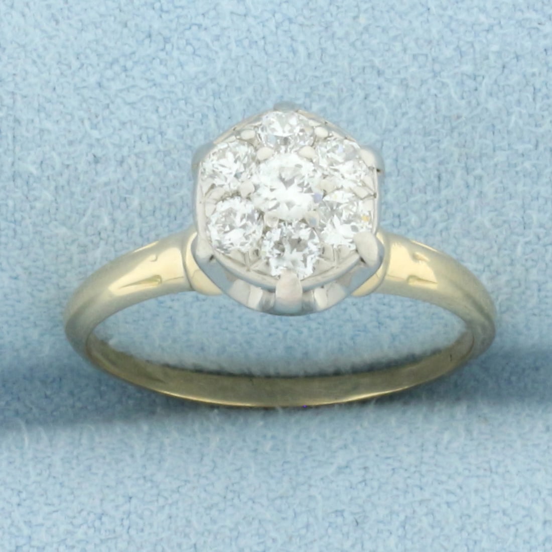 Antique Pave Set Diamond Engagement Ring in 14k Yellow Gold: In 14k yellow gold. Contains one high quality 1/8ct Old European cut diamond, F color/I clarity . Also contains six high quality .07ct Old European cut diamonds, F color/SI clarity. Size: 7. 2.8g.