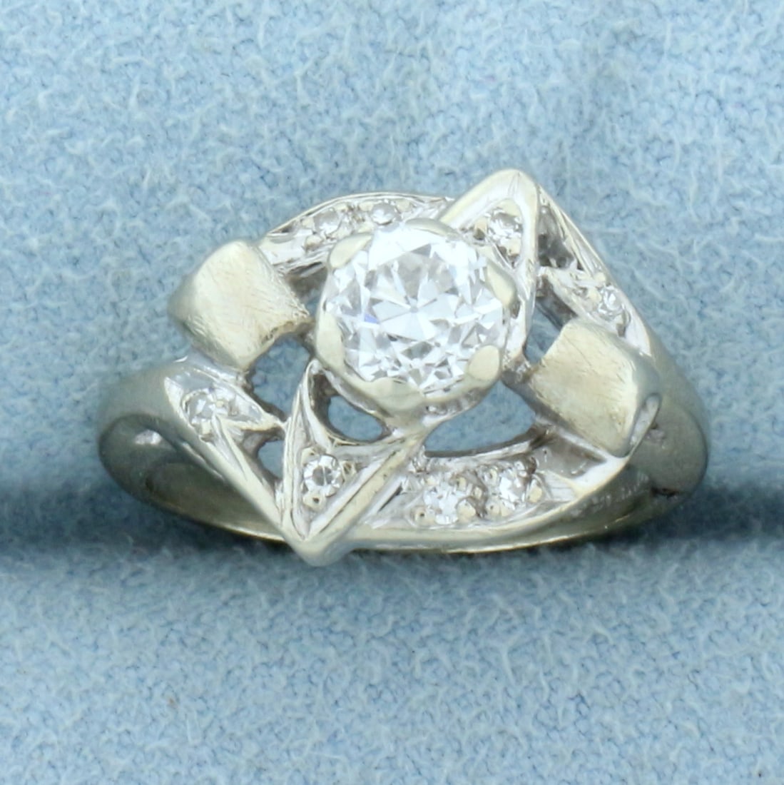 Antique Old European Cut Diamond Ring in 14k White Gold: In 14K White Gold. Contains a .6ct high quality Old European cut Diamond and eight 1/2pt Diamonds, VS clarity/H color. Size 3 1/2. 4.0g.
