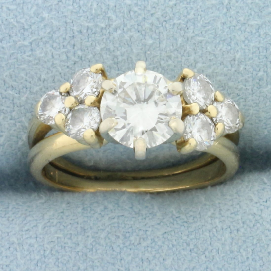 Diamond Engagement Ring and Wedding Band Bridal Set in 14k Yellow Gold: In 14k yellow gold. Center Diamond is a high quality round brilliant, 1.1ct, VS clarity/H color. Also contains six accent diamonds, 2/3ct TW, of similar high quality. Engagement Ring and Wedding Band 