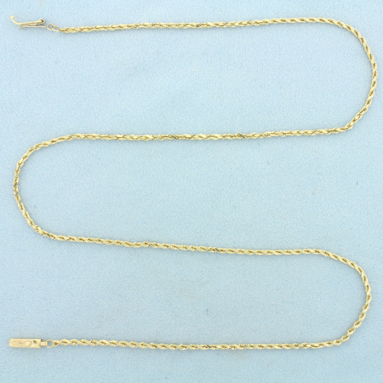 Italian 20 Inch Rope Link Chain Necklace in 14k Yellow Gold: In 14k Yellow Gold. 20 inches long. 2mm wide. Italian made. Slide clasp with safety latch. 7.2g.
