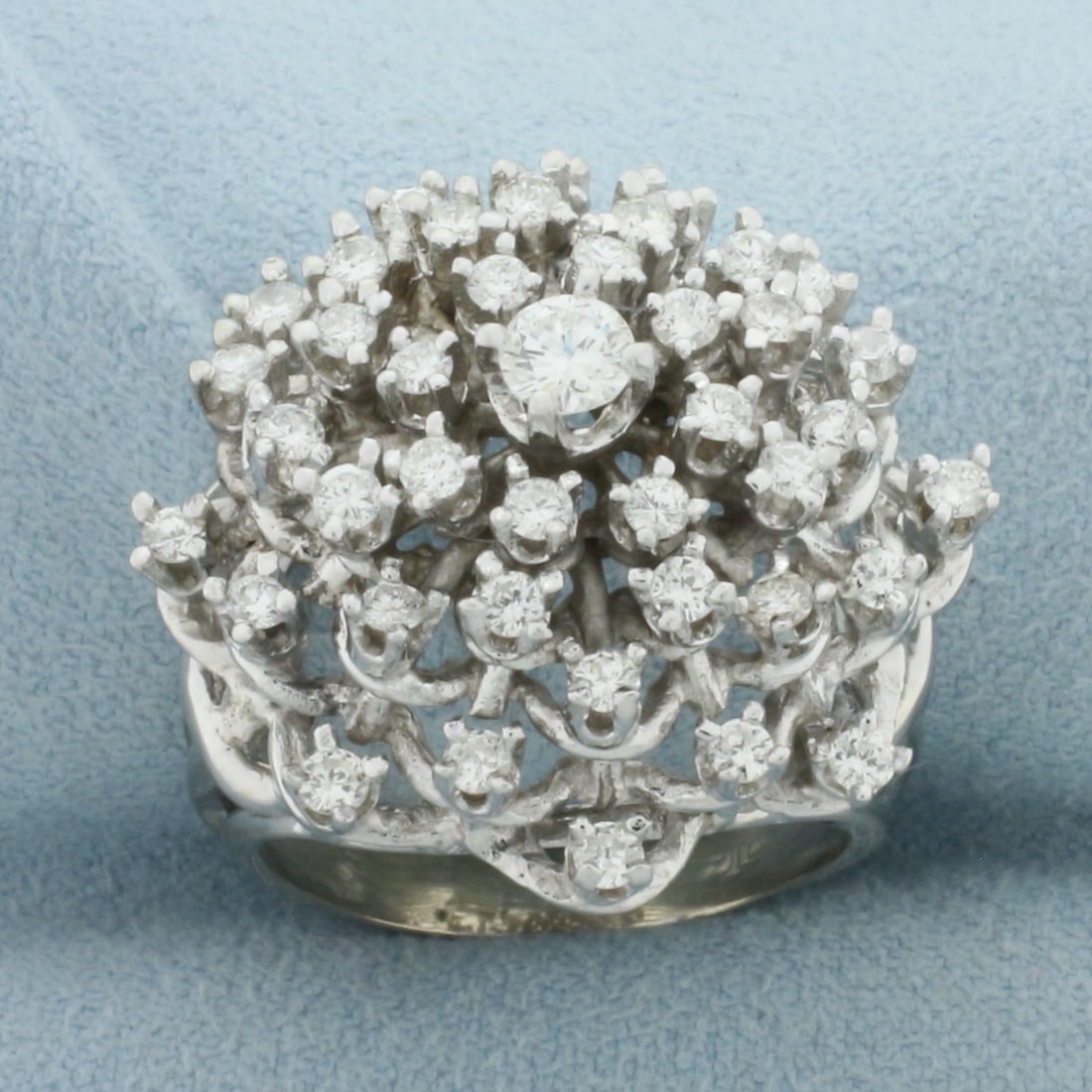 Diamond Starburst Ring in 14k White Gold: In 14k White Gold. Contains one 1/5ct high quality diamond, VS clarity/G color. Also contains 32 high quality .03ct diamonds of similar high quality. 25mm wide at top of ring. Size 8. 13.5g.