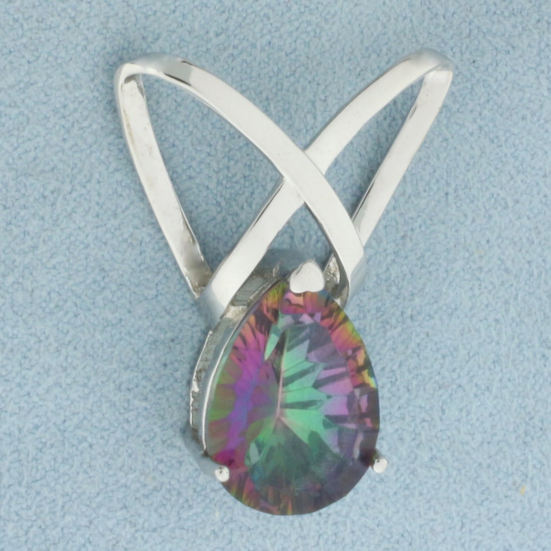 Mystic Topaz Pendant or Slide in Sterling Silver: In .925 Sterling silver. Contains one 12x17mm high quality fancy pear cut natural Mystic Topaz gemstone, approximately 8ct, with intense color and excellent clarity. 1 1/8 inch long. 1 inch wide. 3.9g