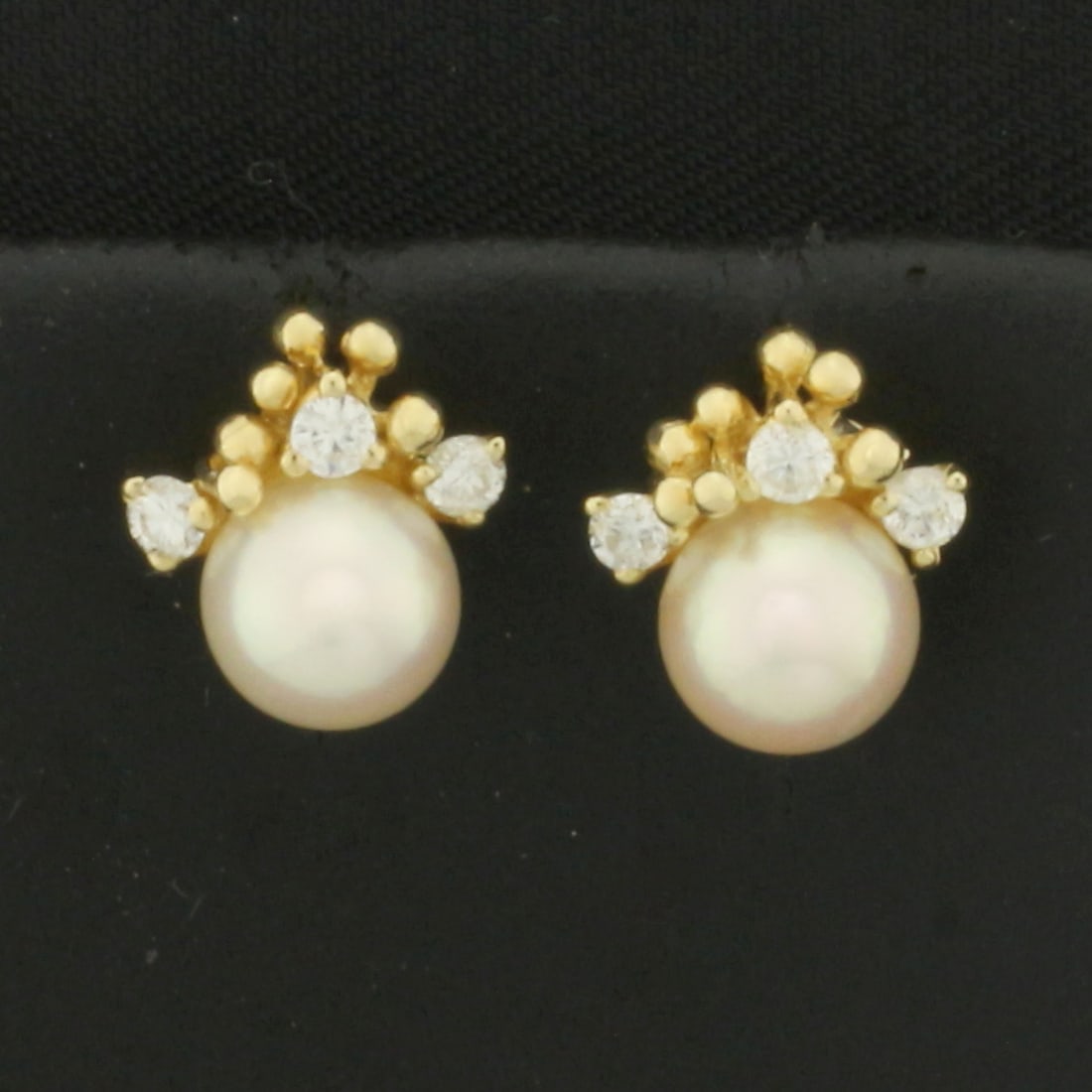 Akoya Pearl and Diamond Earrings in 14k Yellow Gold: In 14k Yellow Gold. Contains two 6mm high quality Cultured Akoya Pears with high luster. Also contains six .03ct high quality diamonds, VS clarity/G color. Friction backs. 2.0g.